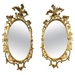 Pair of Early 20th Century Louis XV Style Carved Gilt Wood Frame Oval Mirrors