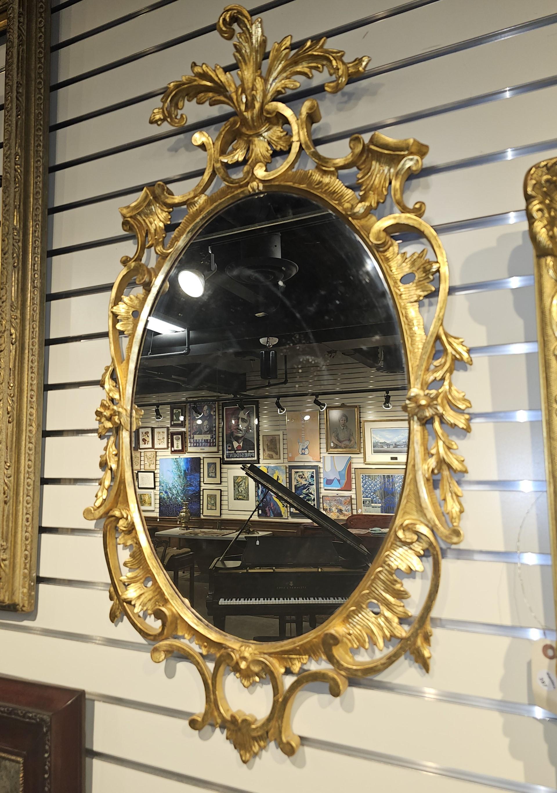 Italian Pair of Early 20th Century Louis XV Style Carved Gilt Wood Frame Oval Mirrors For Sale