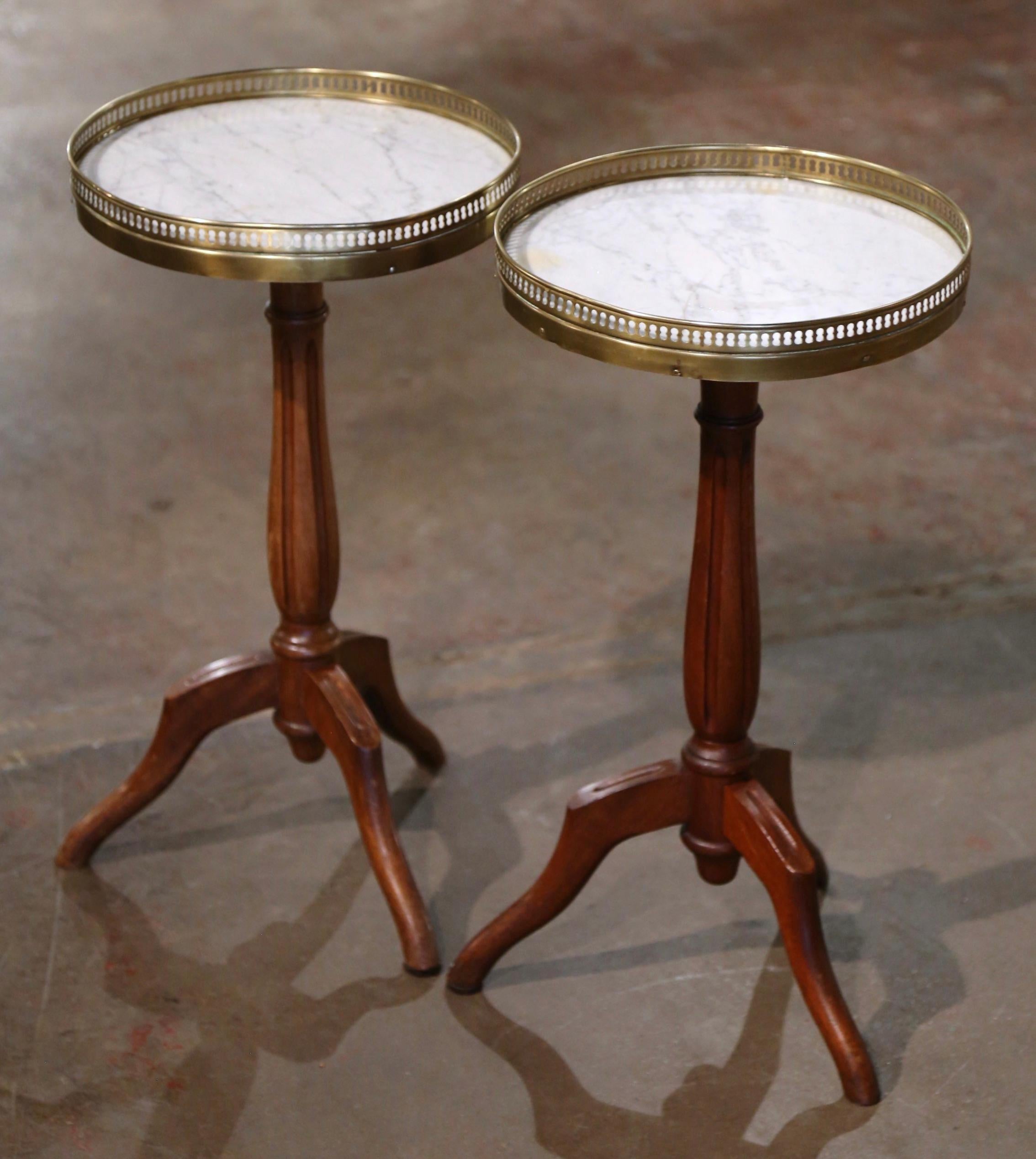 Hand-Carved Pair of Early 20th Century Marble Top Walnut and Brass Pedestal Martini Tables