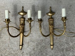 Pair of Early 20th Century Neoclassical Brass Two-Light Sconces with Rams Heads