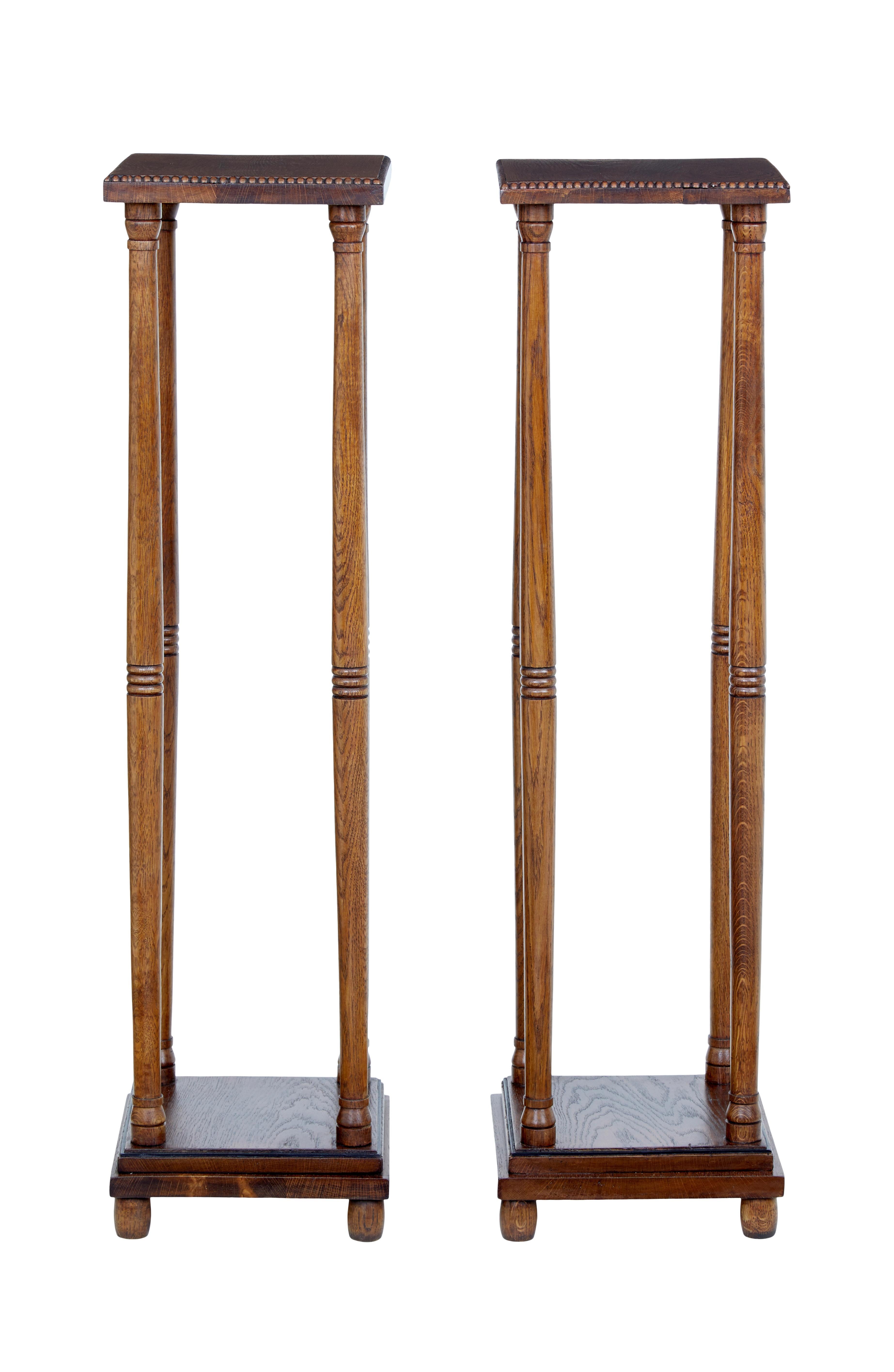 Good quality pair of stands, circa 1900.

Near square top with beaded outer edge. 4 turned supports on each stand which links down to the square stepped base. Base with ebony stringing detail. Standing on bobbin feet.

Ideal for floral displays