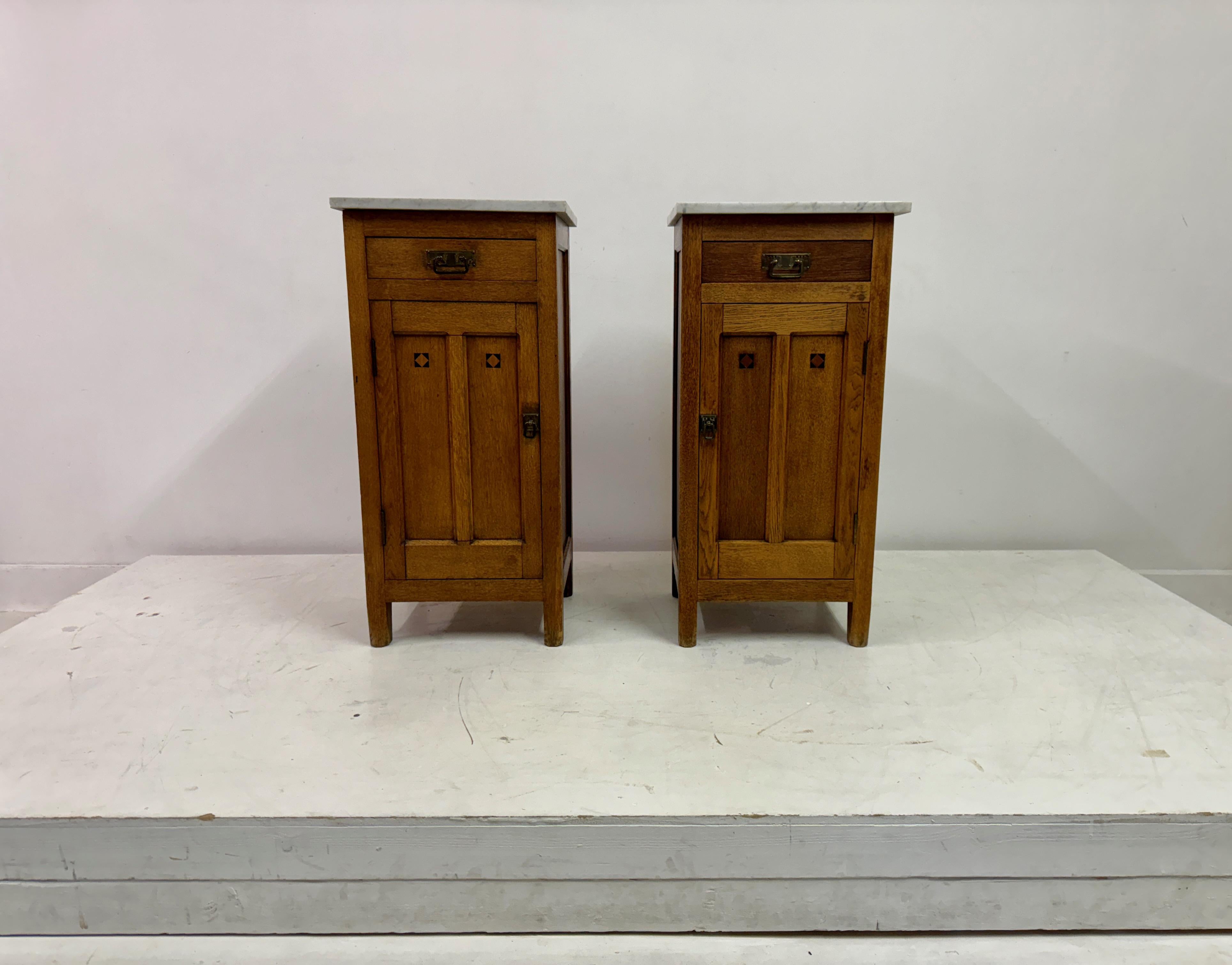 Pair of bedside cabinets

Oak

Marble tops

Brass handles

Ebony inlay detail

Early 20th Century Dutch
