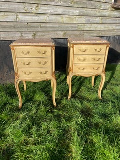 Pair of early 20th century painted and gilded bedside cabinets