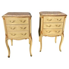 Pair of early 20th century painted and gilded bedside cabinets
