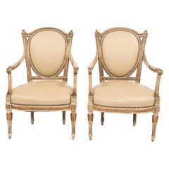 Pair of Early 20th Century Painted and Gilt French Louis XVI Style Fauteuils