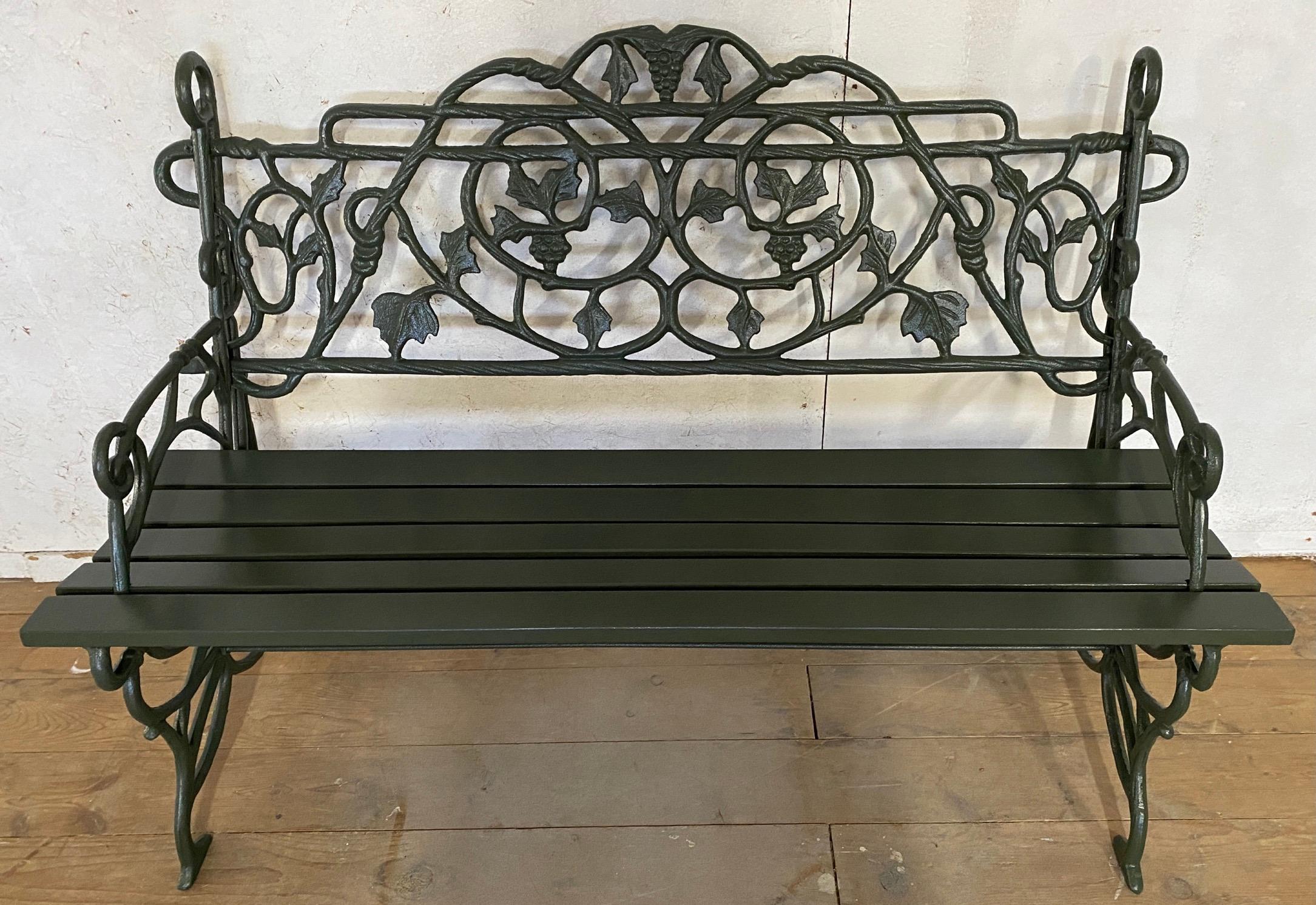 Pair of Early 20th Century Painted Cast Iron Garden Benches with Vine Motifs 4