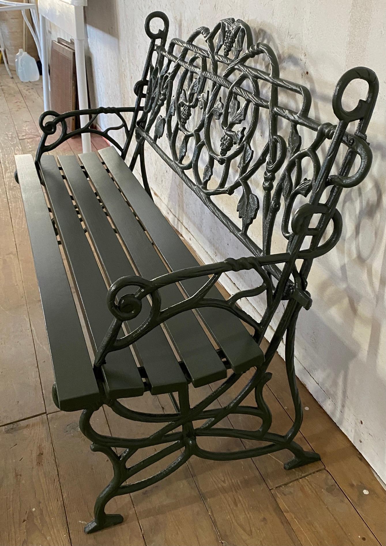 Pair of Early 20th Century Painted Cast Iron Garden Benches with Vine Motifs 1