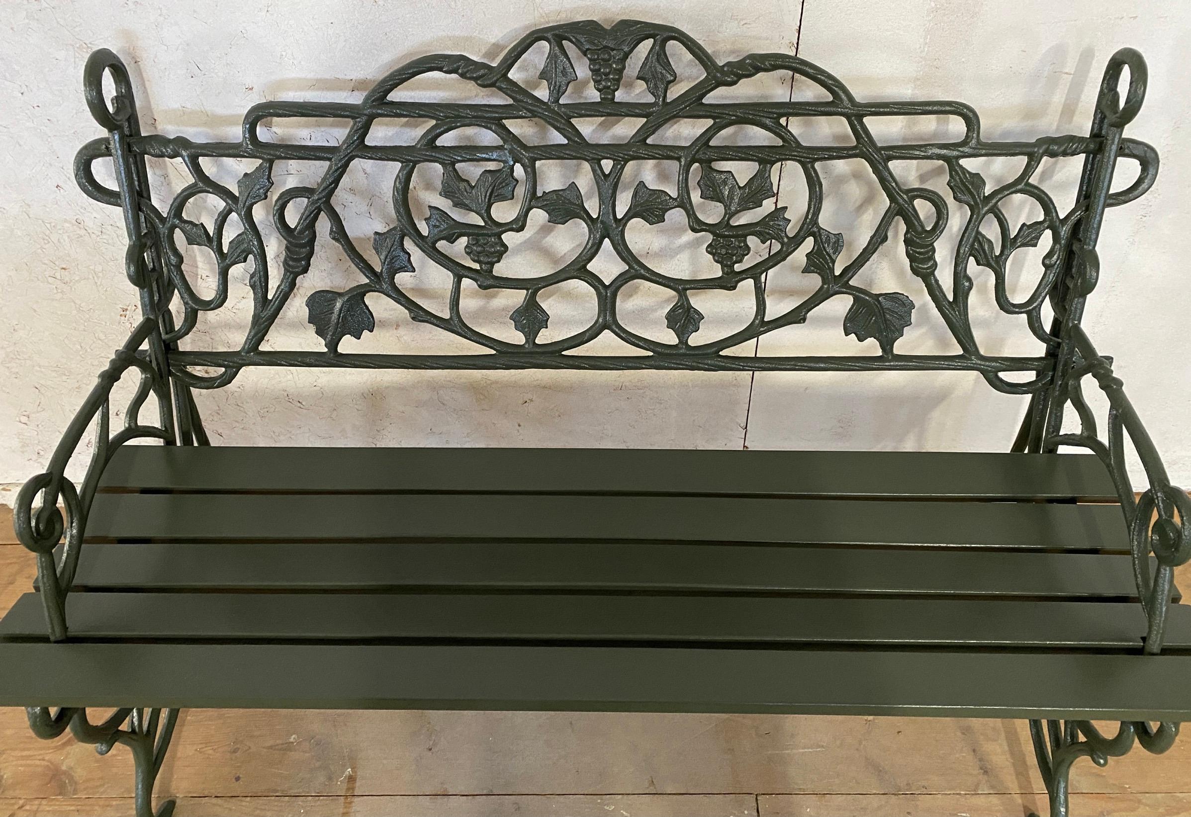 Pair of Early 20th Century Painted Cast Iron Garden Benches with Vine Motifs 2