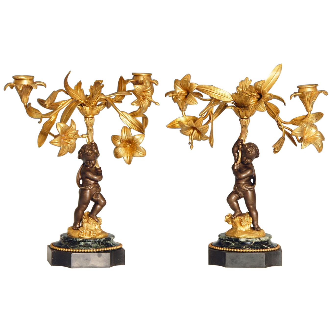 Pair of Early 20th Century patinated bronze Putti Candelabra For Sale