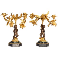 Pair of Early 20th Century patinated bronze Putti Candelabra