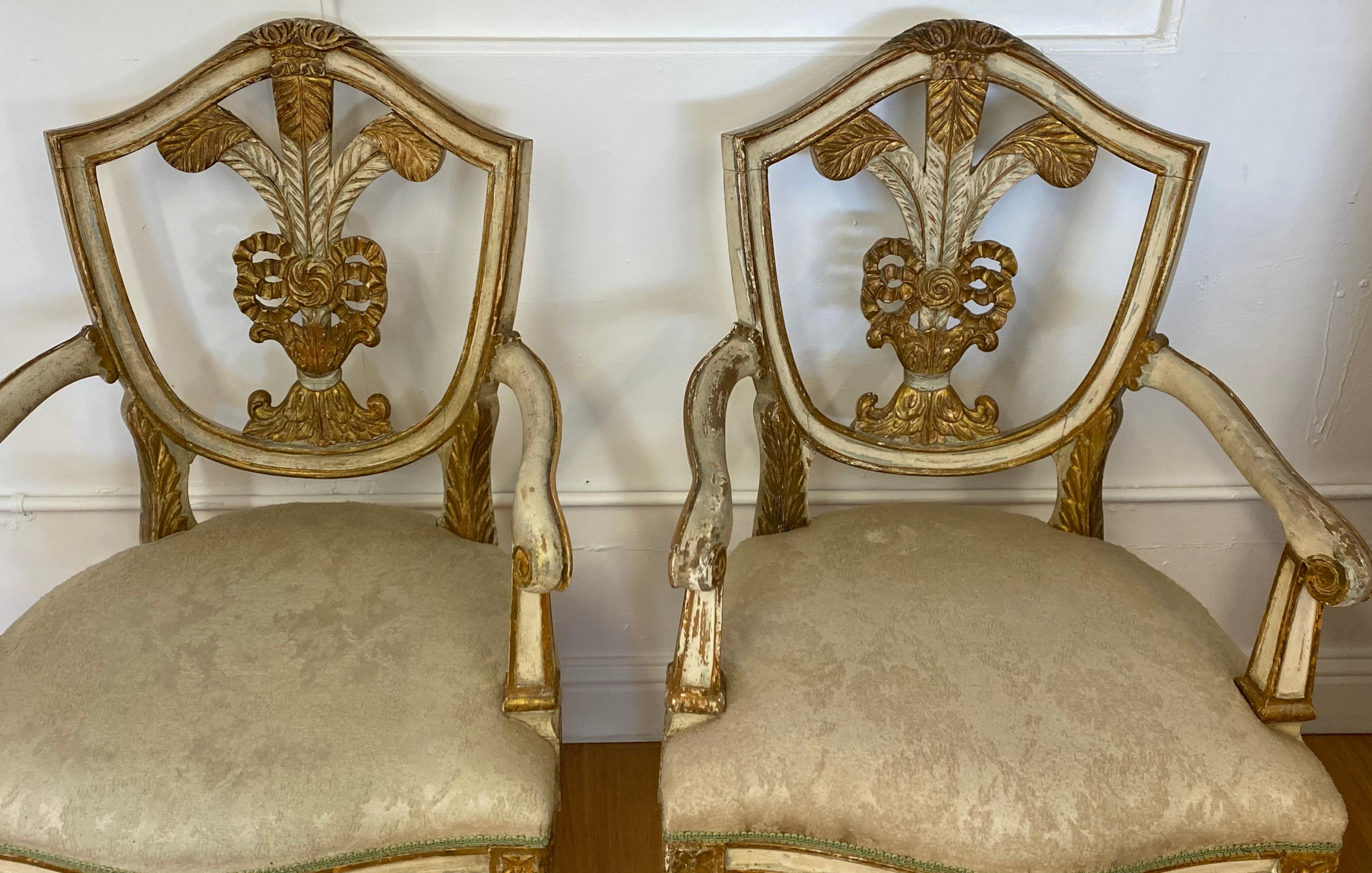 Pair of early 20th century Prince of Wales style arm chairs

Painted eggshell white and gold

Measures: 24
