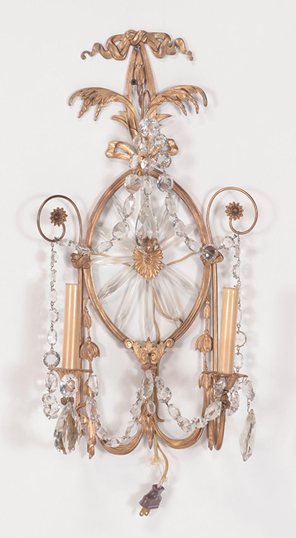 Pair of Early 20th century Regency Style Bronze & Crystal Wall Sconces
Stunning pair of sconces that will add so much style and glamour to a home.
Wired for electricity and ready to be installed in the right room. circa 1920s.
Measure: 22.5