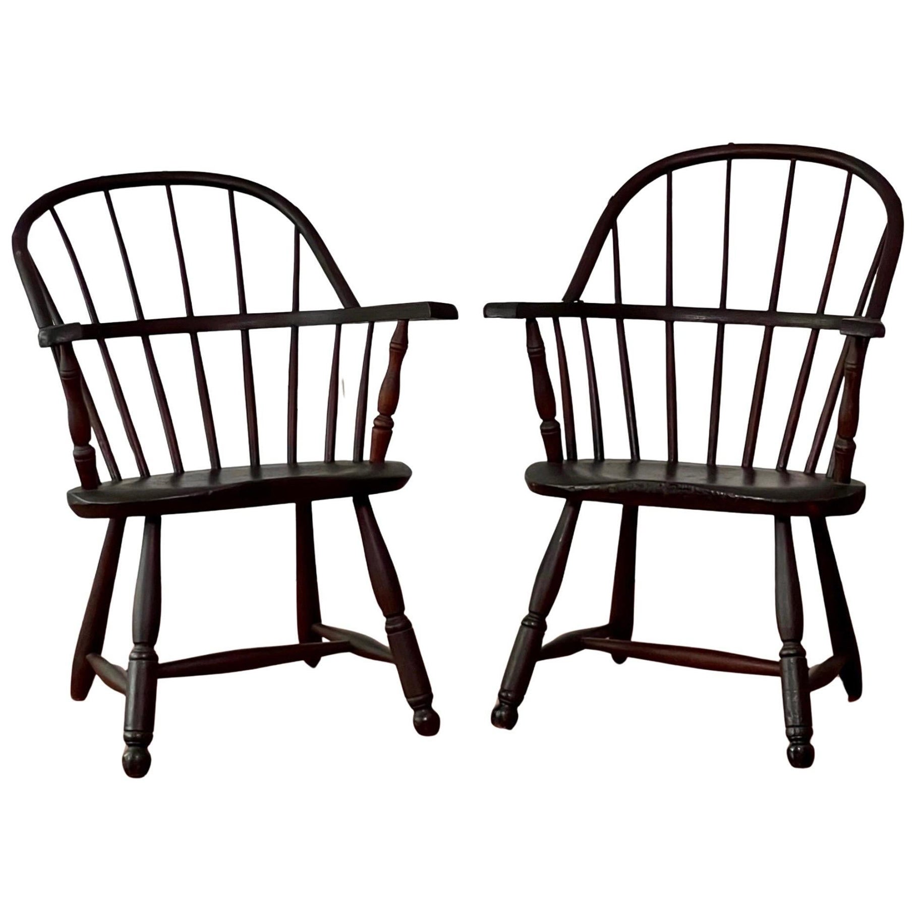Pair of Early 20th Century Sack Back Windsor Armchairs in a Dark Finish For Sale