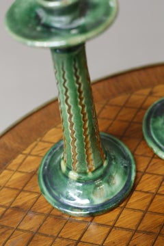 Pair of early 20th century Spanish green glazed candlesticks