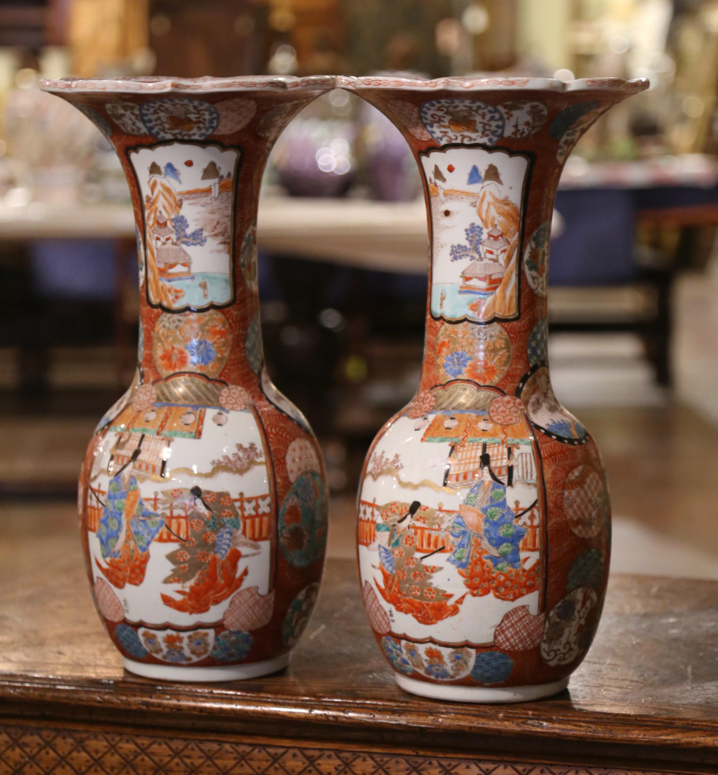Make a beautiful statement in your living room by placing these large, antique vases on your mantle or console. Sculpted in Japan circa 1920, each porcelain Imari vase has an ovoid form, with long necks and open flared rims. The ceramic vases are