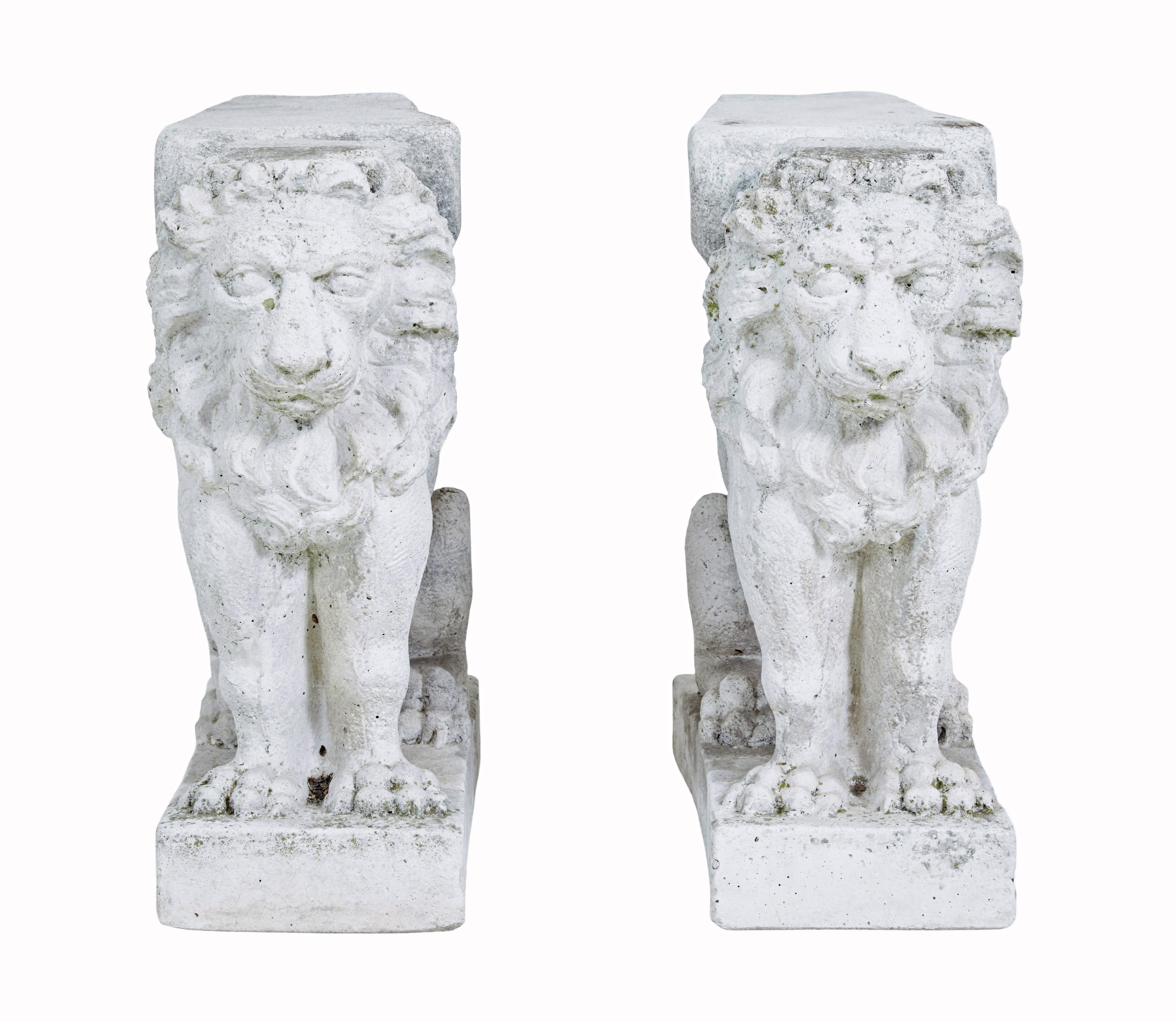 Pair of early 20th century stone garden lion pedestals circa 1920.

Here we have a great pair of architectural stone lions which act as pedestals for a low garden bench with the addition of some woodwork.  Could work equally well as pair pedestals