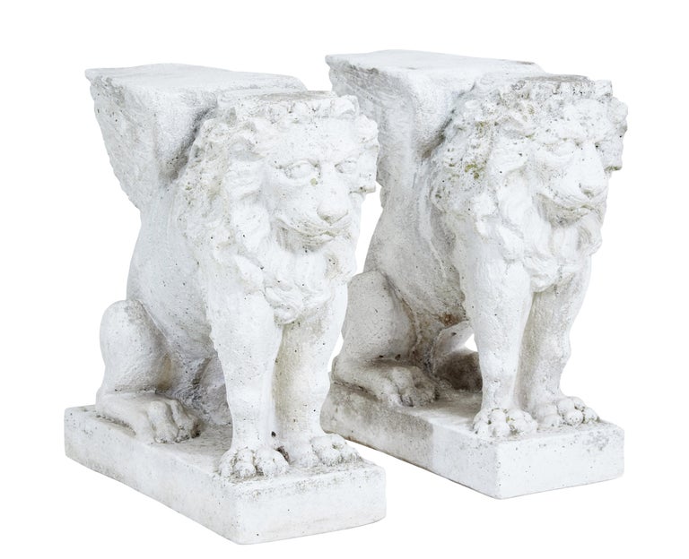 Pair of early 20th century stone garden lion pedestals For Sale at 1stDibs