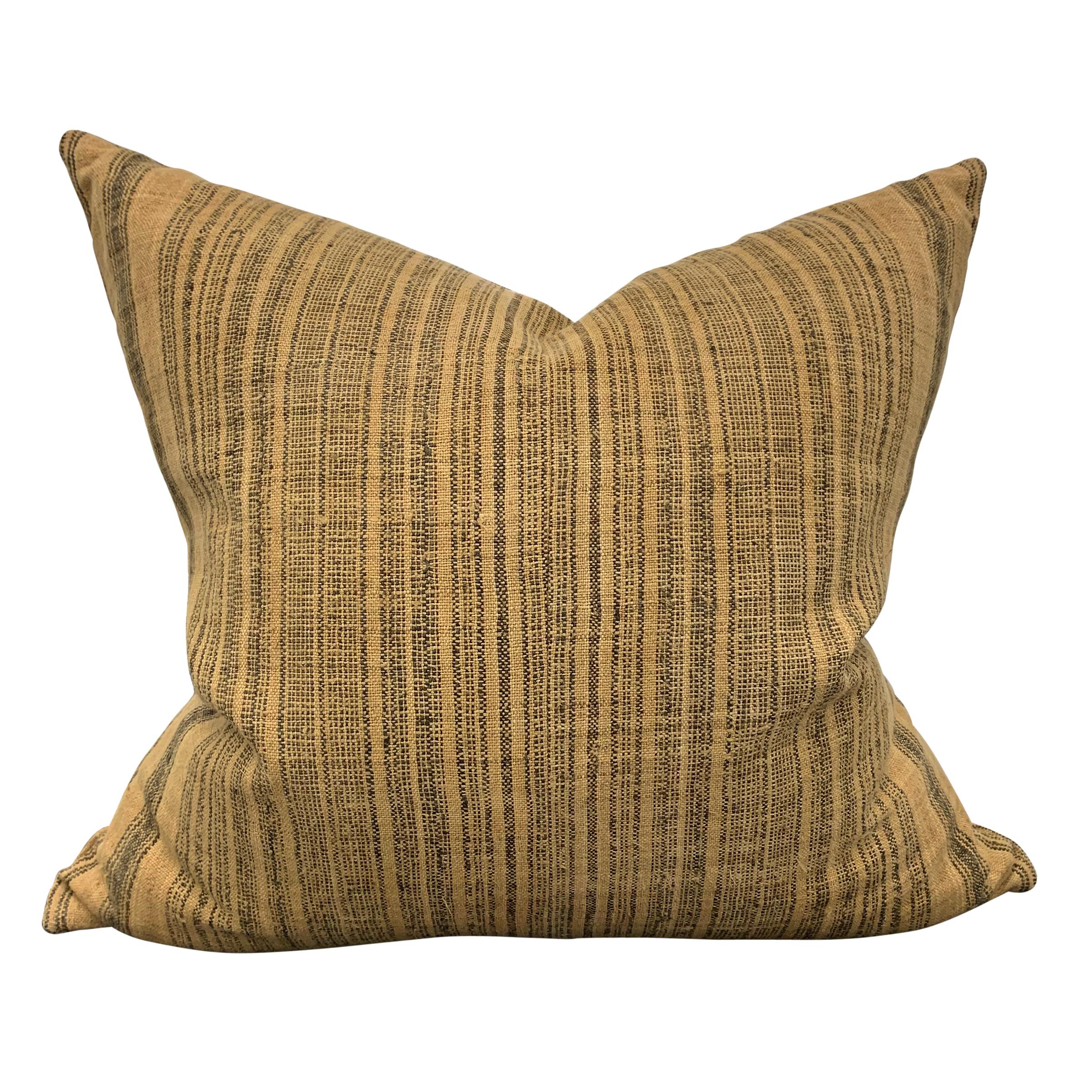 A pair of custom pillows made from early 20th century hand-woven Thai Hill Tribe woven linen with stripes of varying widths, filled with down.