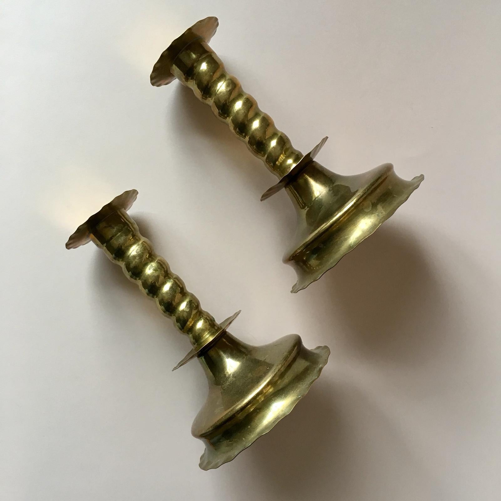 Set of two light weight candlestick holders from Sweden. These candleholders design features Baroque style elements. I like its beautiful patina.