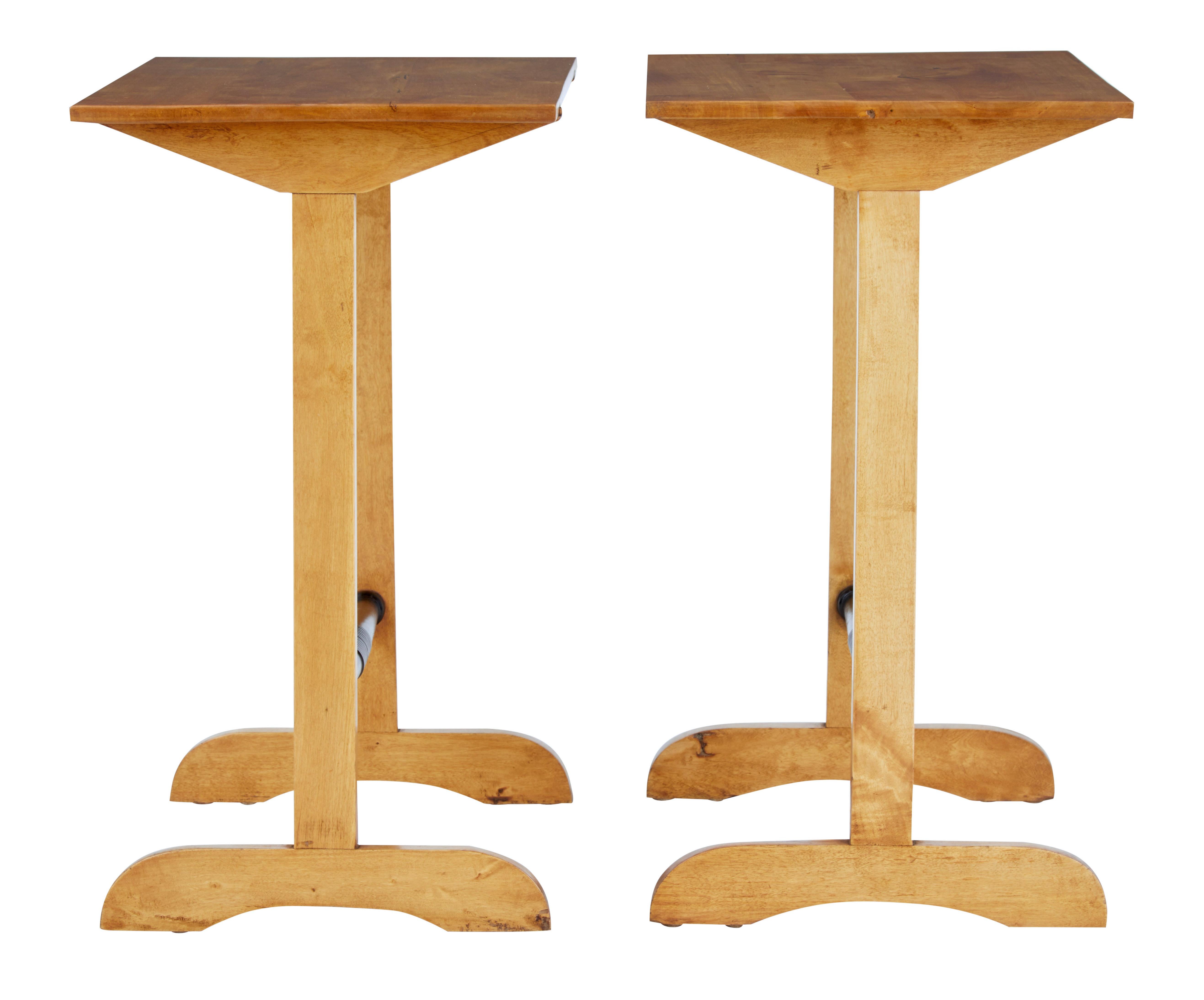 Pair of early 20th century Swedish birch side tables, circa 1920.

Unusual pair of birch tables that have potential multiple uses, but we think they would work well as a pair of lamp tables. Recently restored and back to their rich birch color.