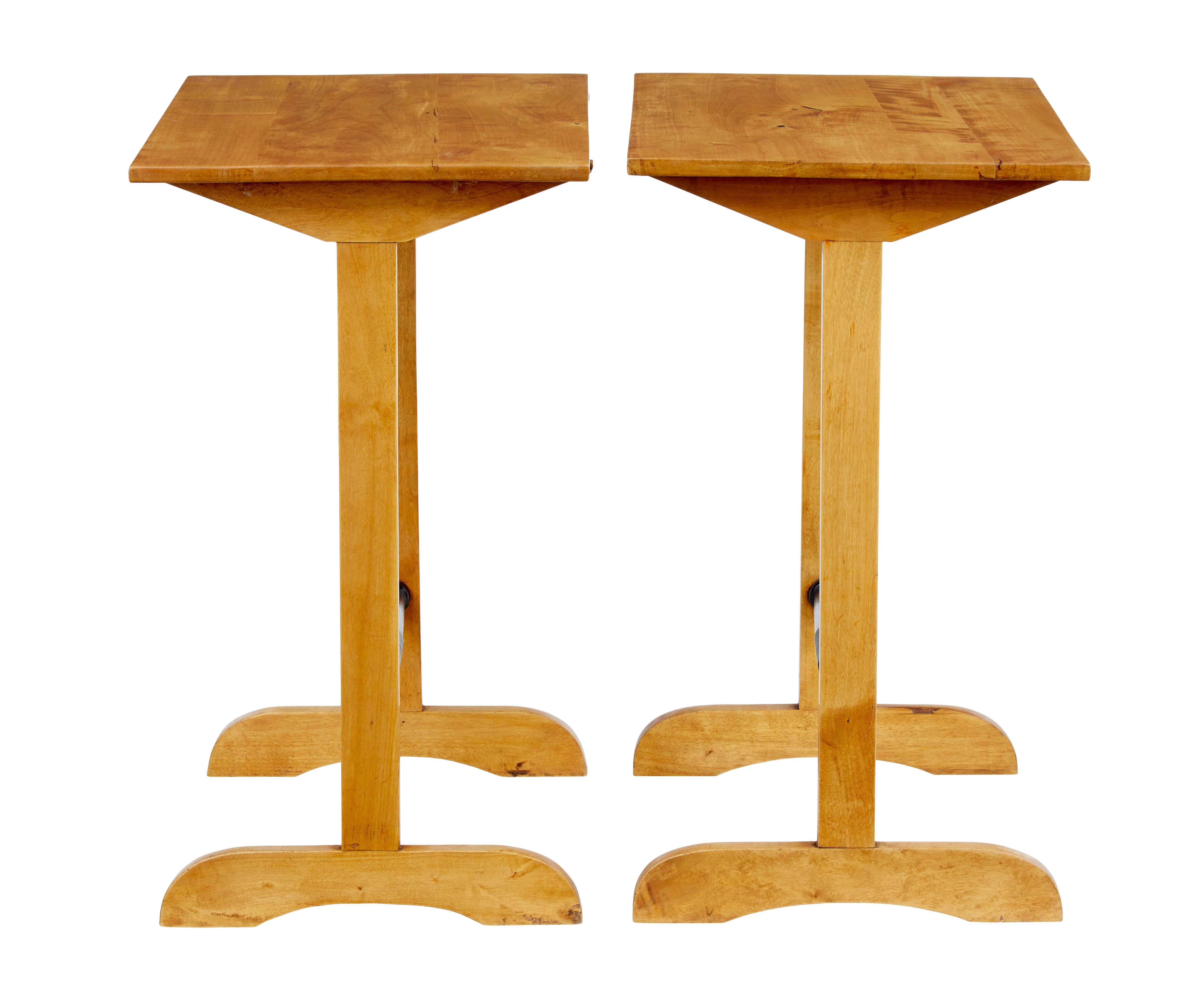 Pair of early 20th century Swedish birch side tables, circa 1920.

Unusual pair of birch tables that have potential multiple uses, but we think they would work well as a pair of lamp tables. Recently restored and back to their rich birch colour.