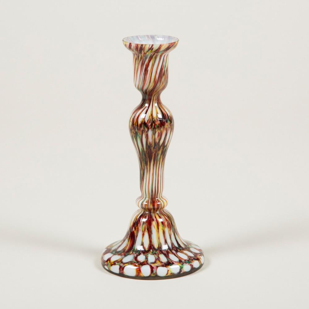 A pair of early 20th century tapering colored glass candlesticks, English, circa 1900.