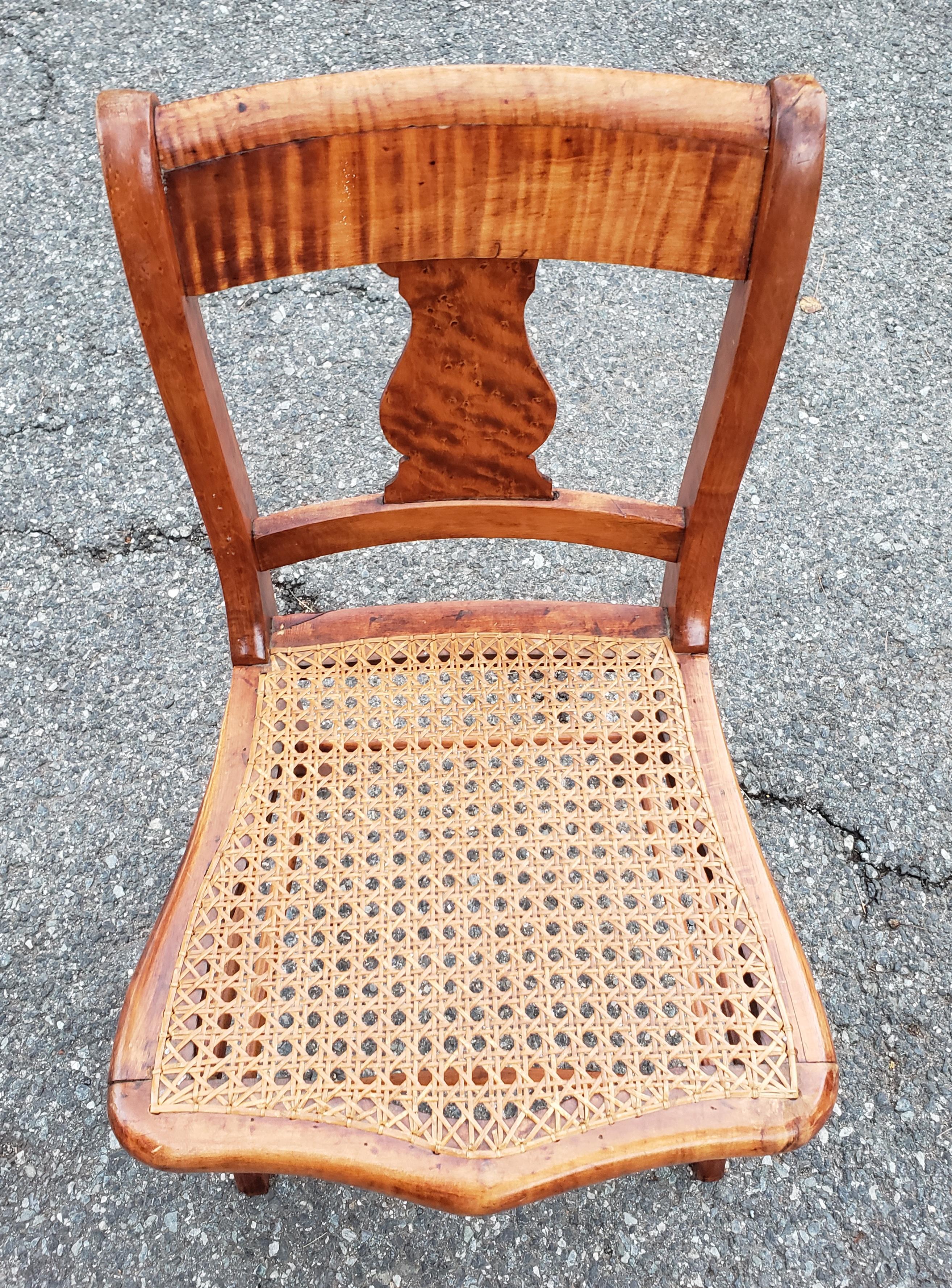 A pair of early 20th century Victorian tiger maple side chairs.
Chairs were Recaned down the road. 