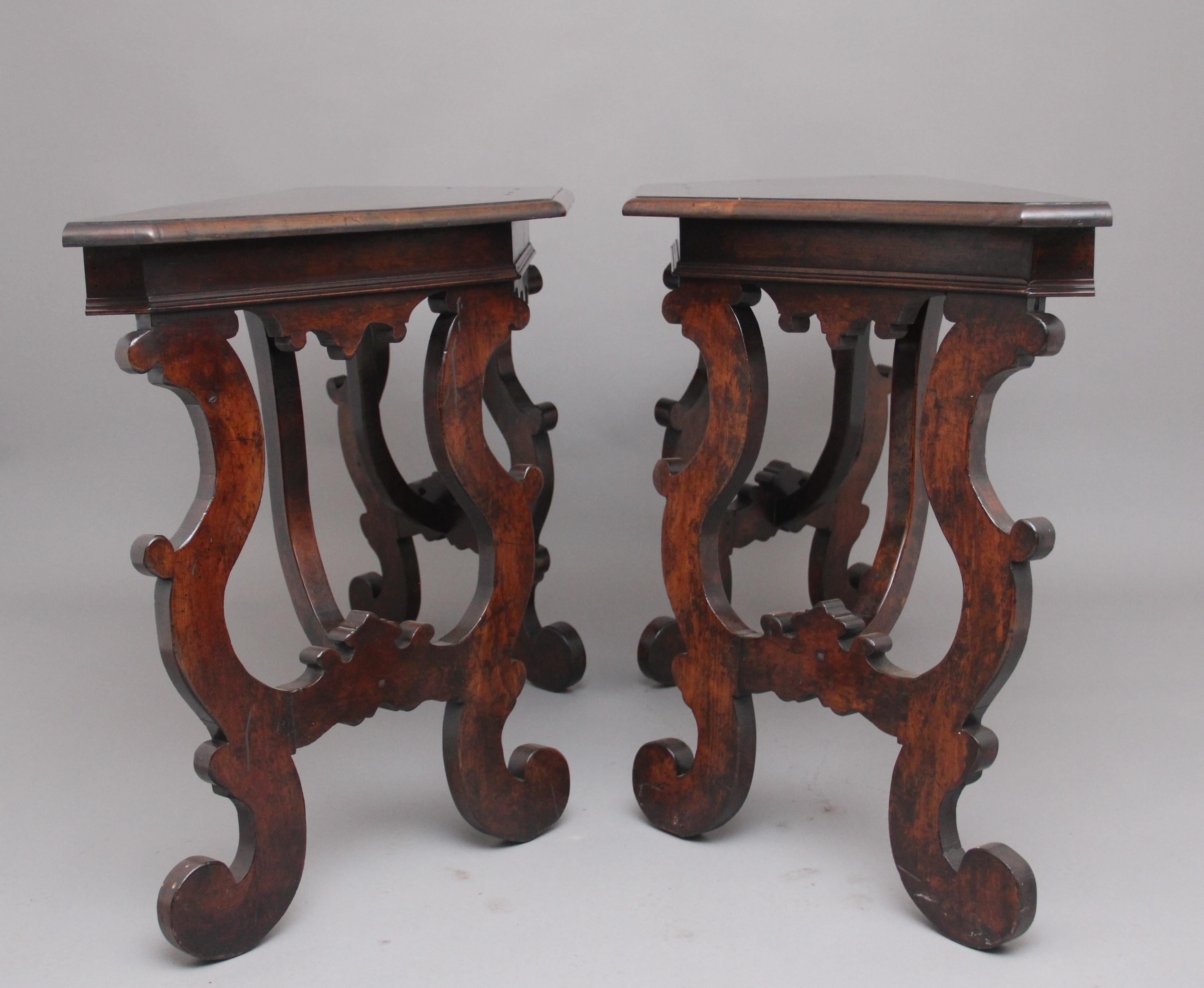 A pair of early 20th century Spanish walnut consul tables in the 18th century style, having a moulded edge top with nice figuration above a frieze with double D moulding, nice shaped apron below, supported on decorative shaped legs very much in the