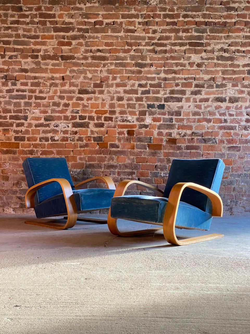 Pair of Early Alvar Aalto Tank Chairs Model 400 by Artek Finland Circa 1940?

Magnificent and rare pair of early twentieth century 'Tank' Model 400 armchairs, designed by Alvar Aalto and Manufactured by O.y. Huonekalu-ja Rakennustyötehdas A.b.,