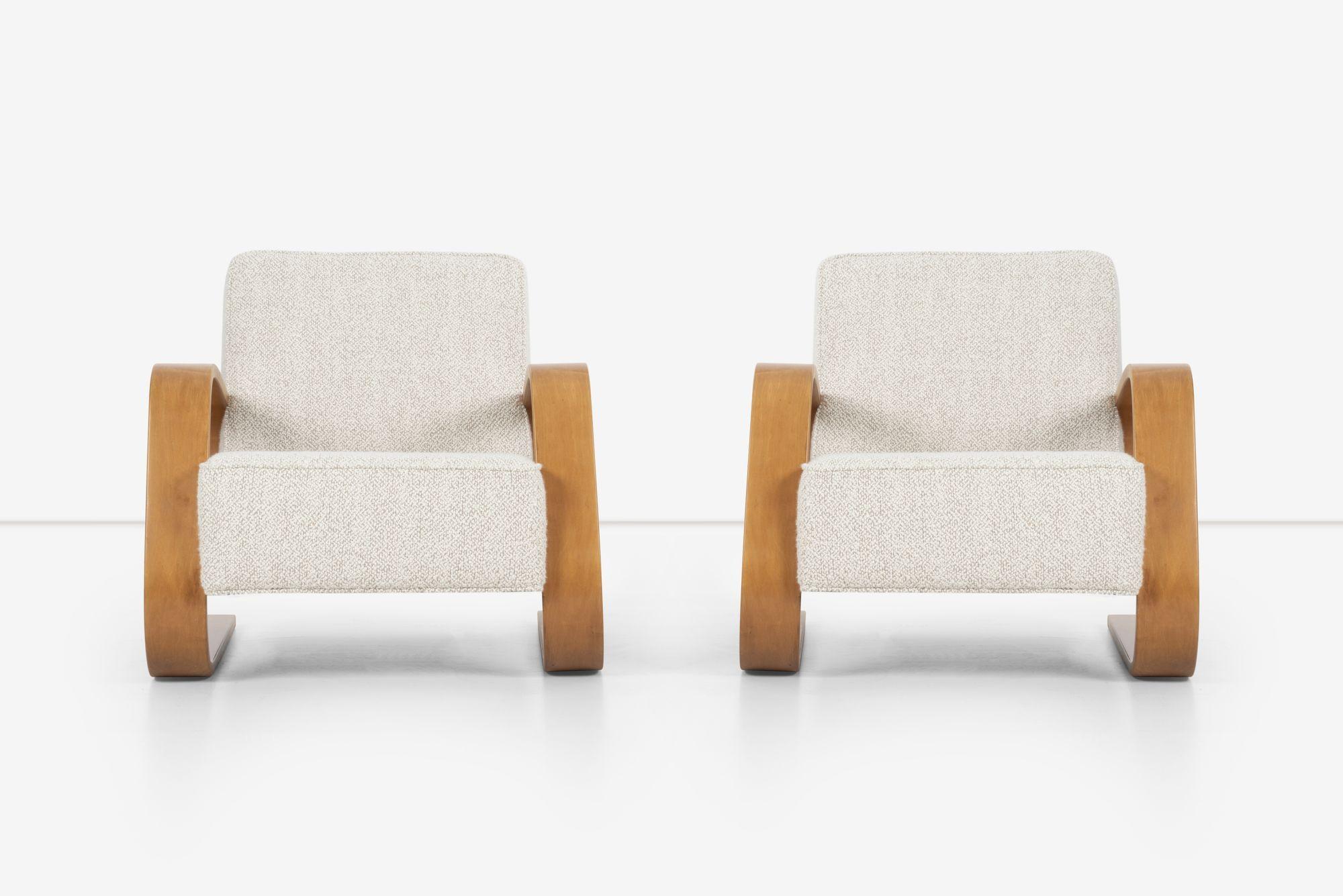 Pair of Early Alvar Aalto Tank chairs Model 400 by Artek Finland Circa 1940
Manufactured by O.y. Huonekalu-JA Rakennustyötehdas A.b., Turku, for Artek, Finland.
Laminated bent birch frames restored, and reupholstered with Great Plains heavy-nubby