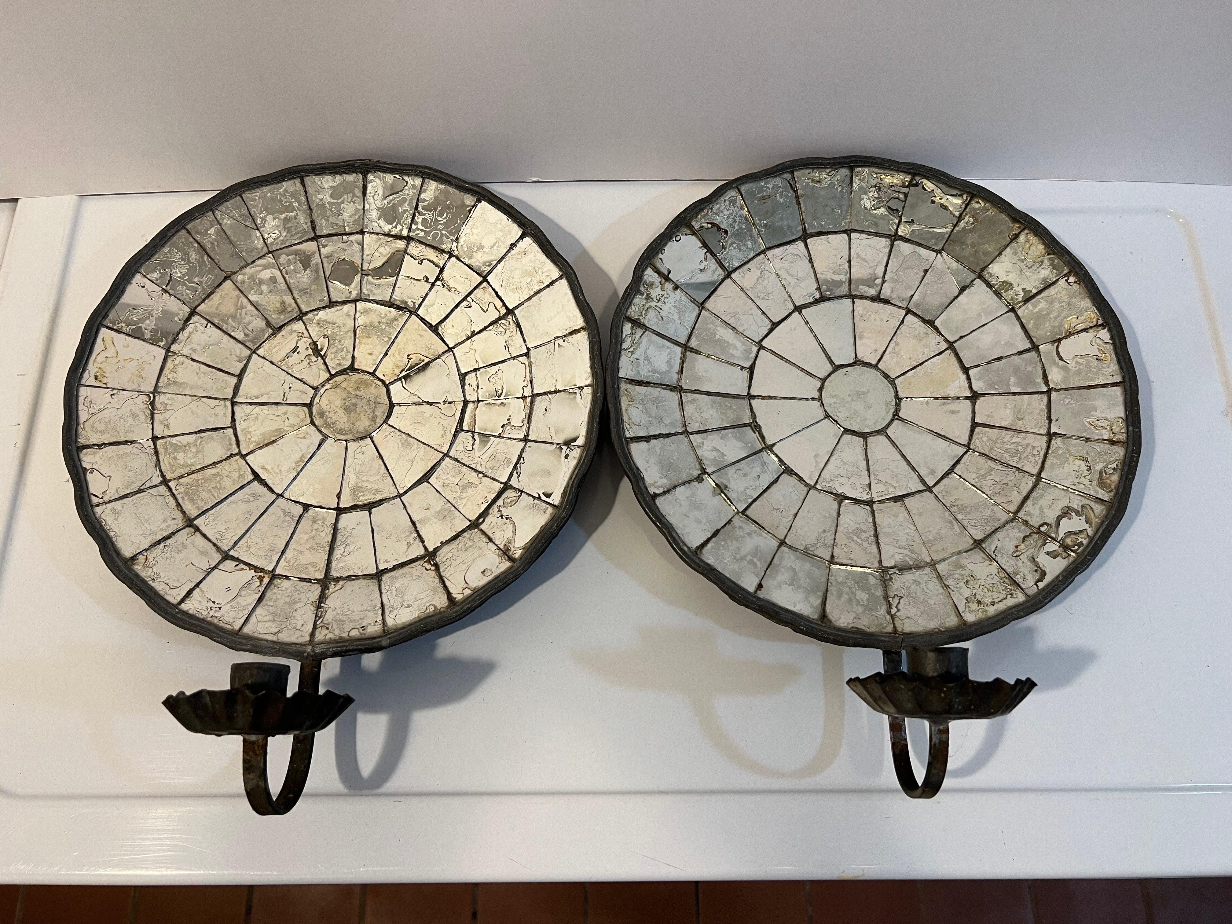 Pair of Early American Reflective candle sconces. Composed of early leaded glass and tin with crimped drip pan. Perfect for that candlelight ambience. Can be electrified if desired.
Large Round mirrored backs give off a very decorative design and