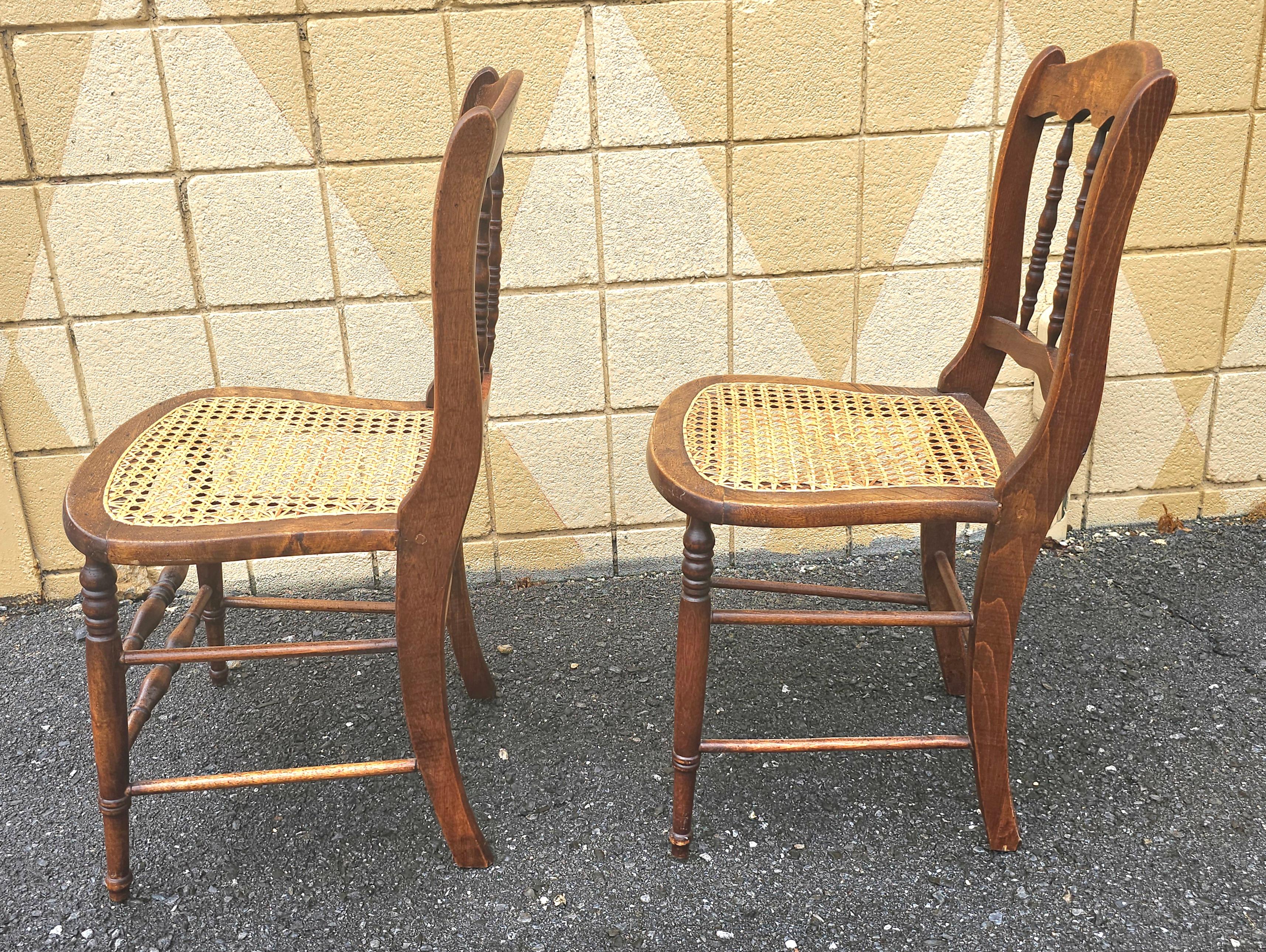 American Colonial Pair of Early American Walnut and Cane Seat Spindle Back Side Chairs For Sale