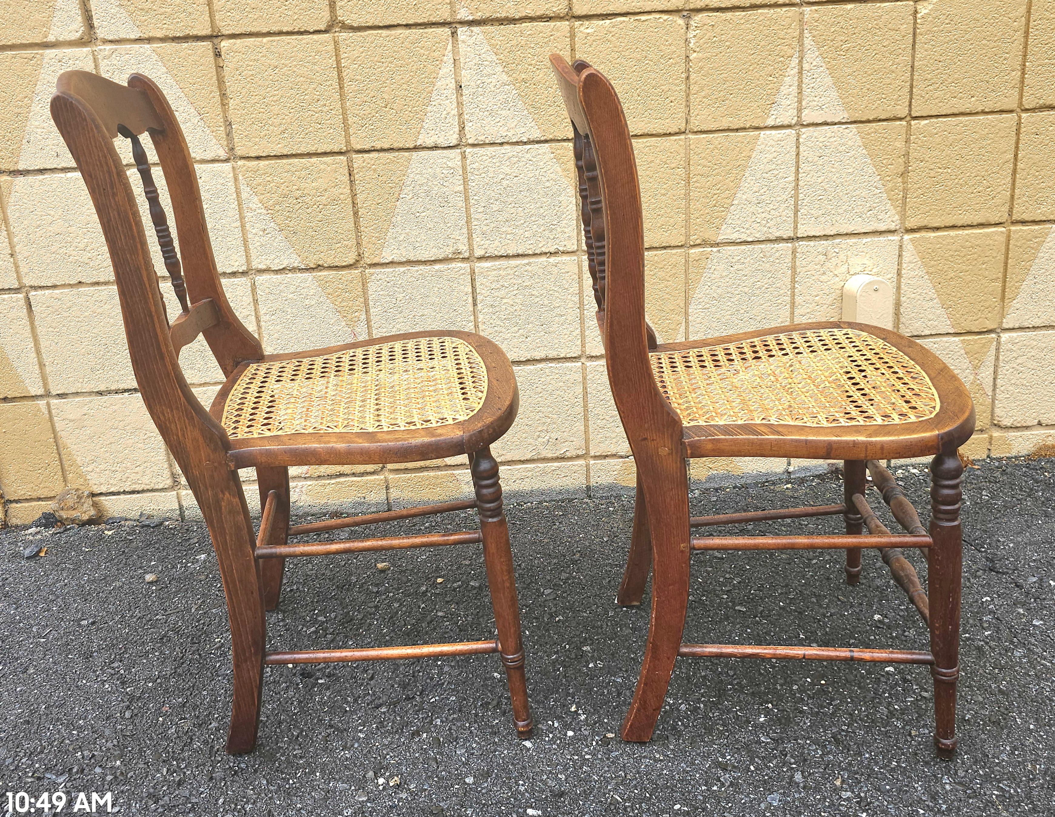 Caning Pair of Early American Walnut and Cane Seat Spindle Back Side Chairs For Sale