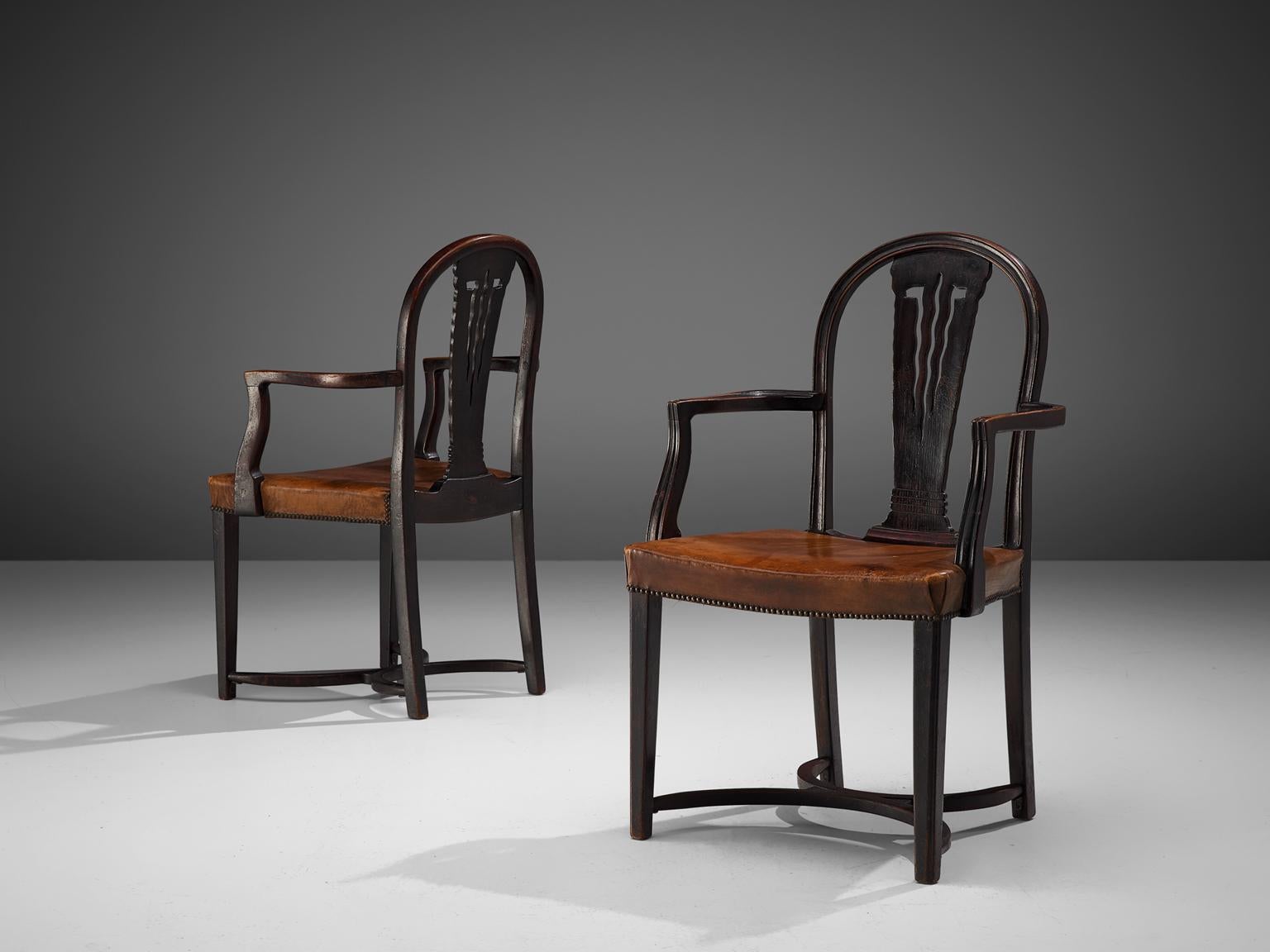 Thonet, pair of armchairs, bentwood and leather, Austria, 1920s

A stunning Jugendstil pair of armchairs by Thonet, produced in the 1920s. The chairs are feature the architect-designed Viennese bentwood furniture in the Secession style, a genre that