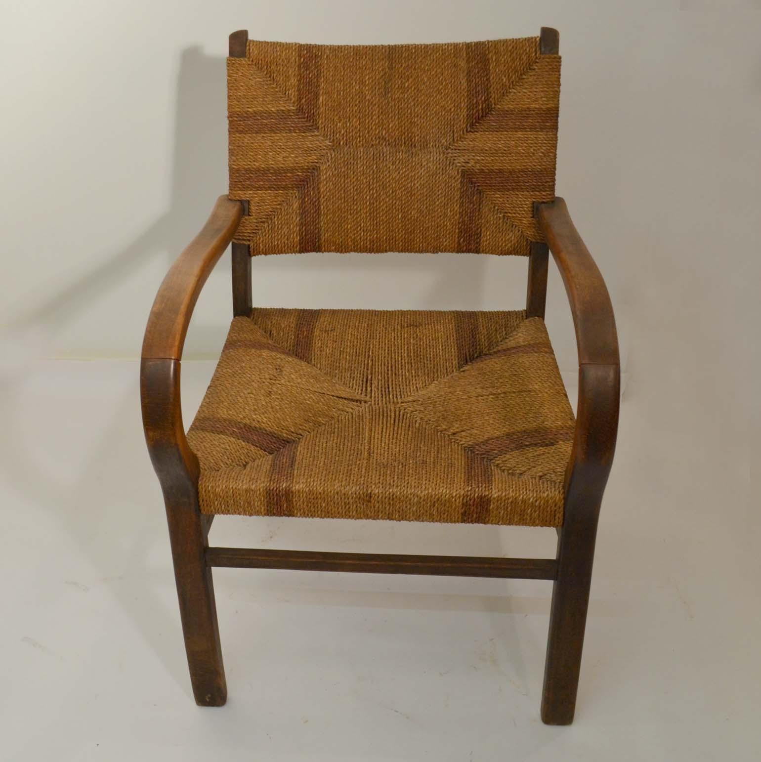 A pair of Bauhaus beech wood and two-tone woven seagrass rope armchairs, by Erich Dieckmann (1896-1944), circa 1925-1930. The use of quality hardwoods, rope and cane matting moderated the austere geometry of the designs and this pair with the