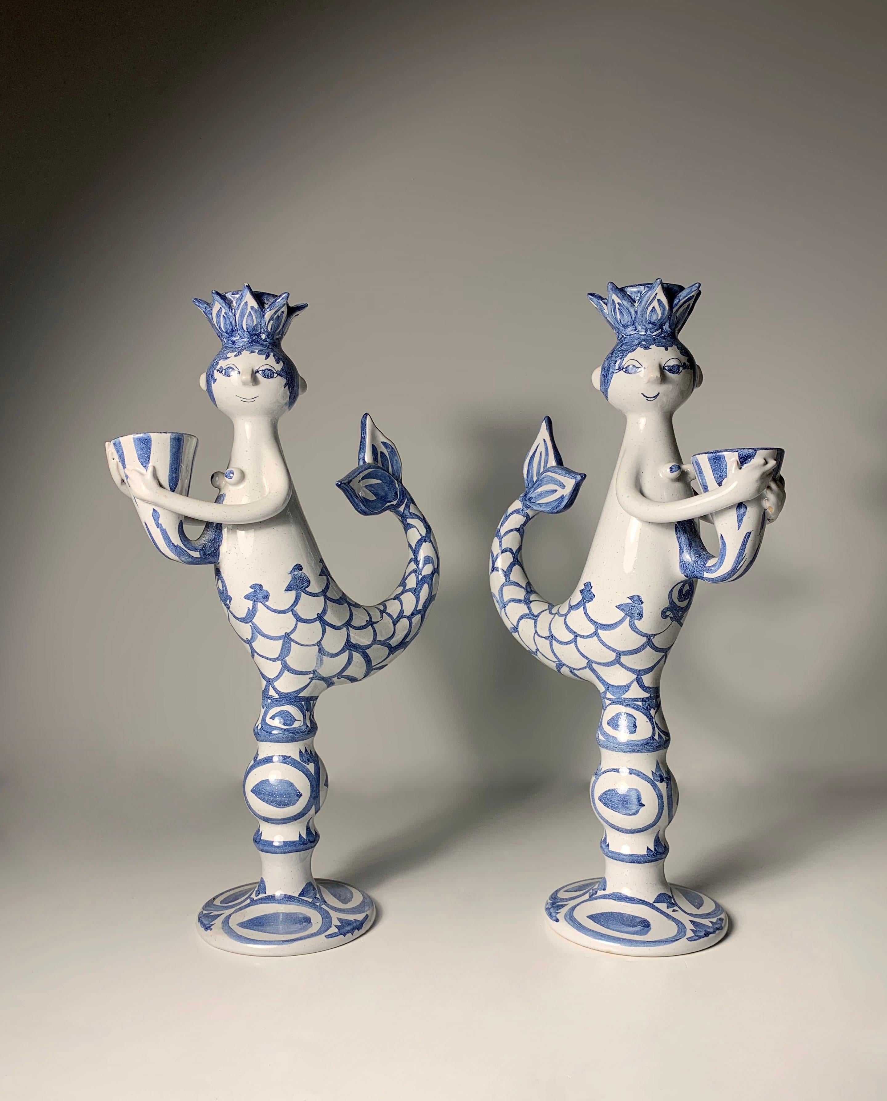 Pair of Early Bjorn Wiinblad Art Pottery Candlesticks. Signed & Dated 1969.

Some minor knicks on one as shown. One minor professional restoration to a small chip on the other.  More pictures available upon request.