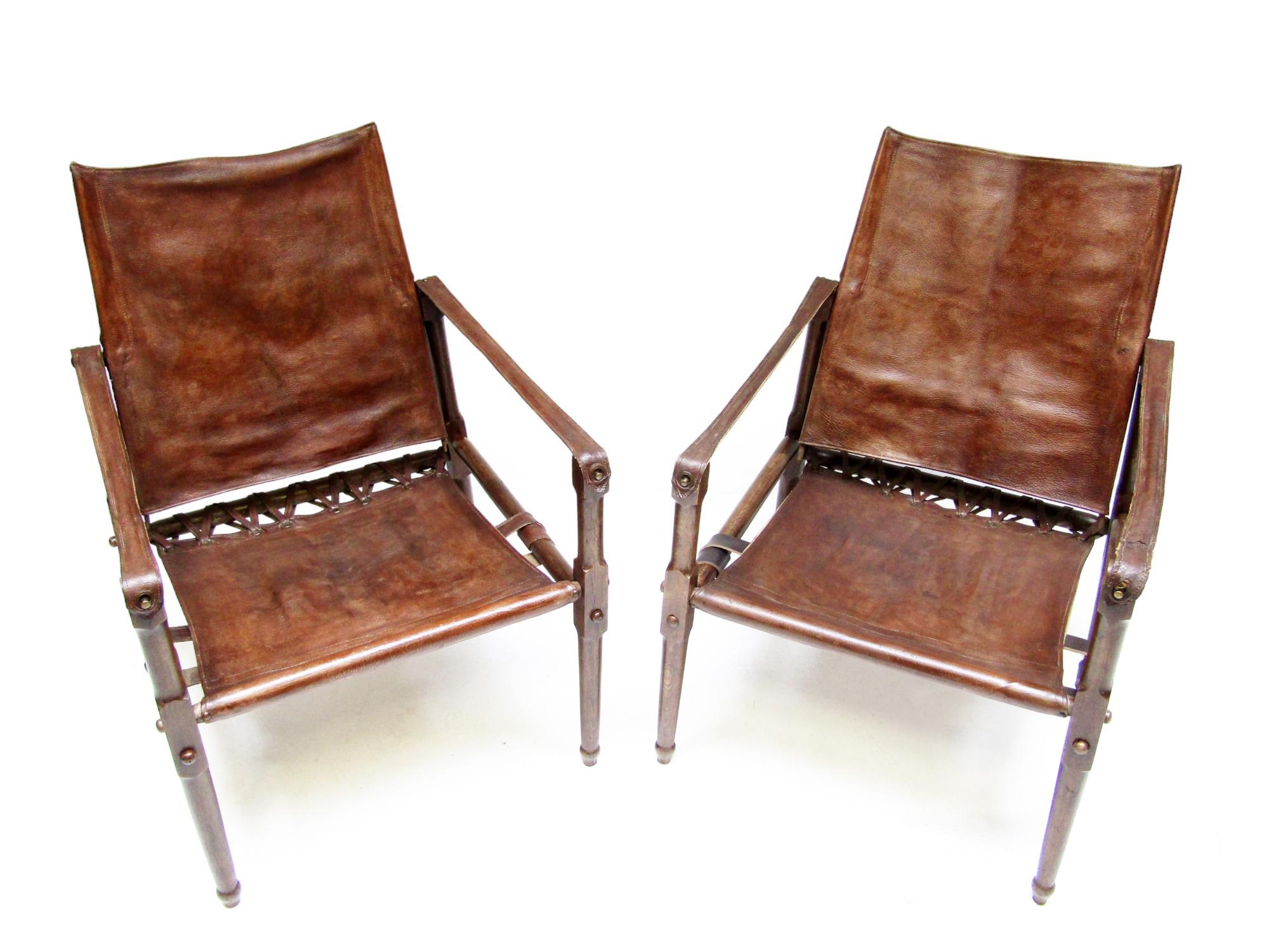 British Colonial Pair Of Early British Roorkhee Safari Campaign Chairs In Leather, Circa 1920