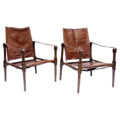 Pair Of Early British Roorkhee Safari Campaign Chairs In Leather, Circa 1920