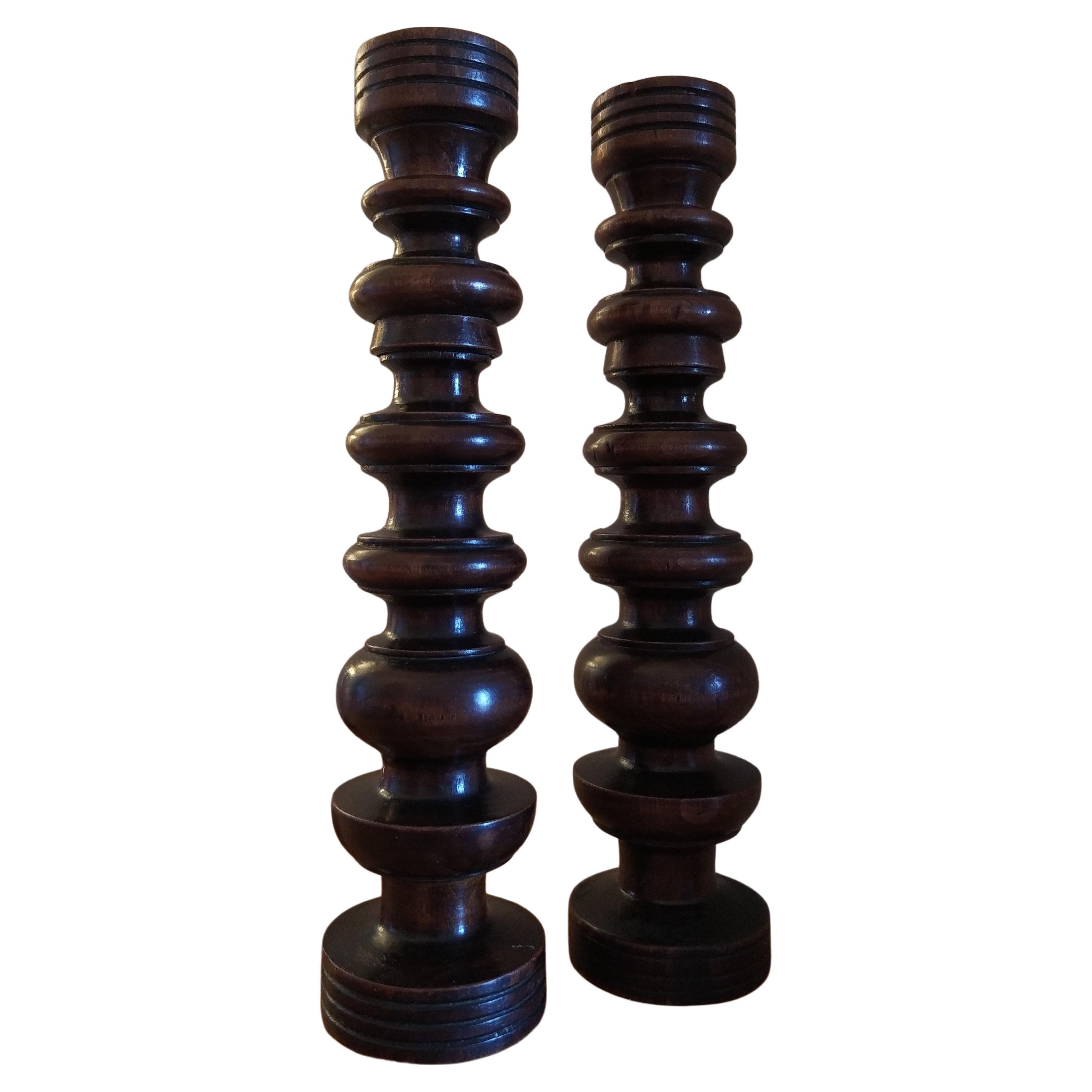A fabulous pair of French turned walnut candlesticks dating from the early C20th, circa 1900-10.

These candlesticks would fit into a period or modern interior, they have a look of the mid century designer Robert Welch, albeit 50 to 60 years