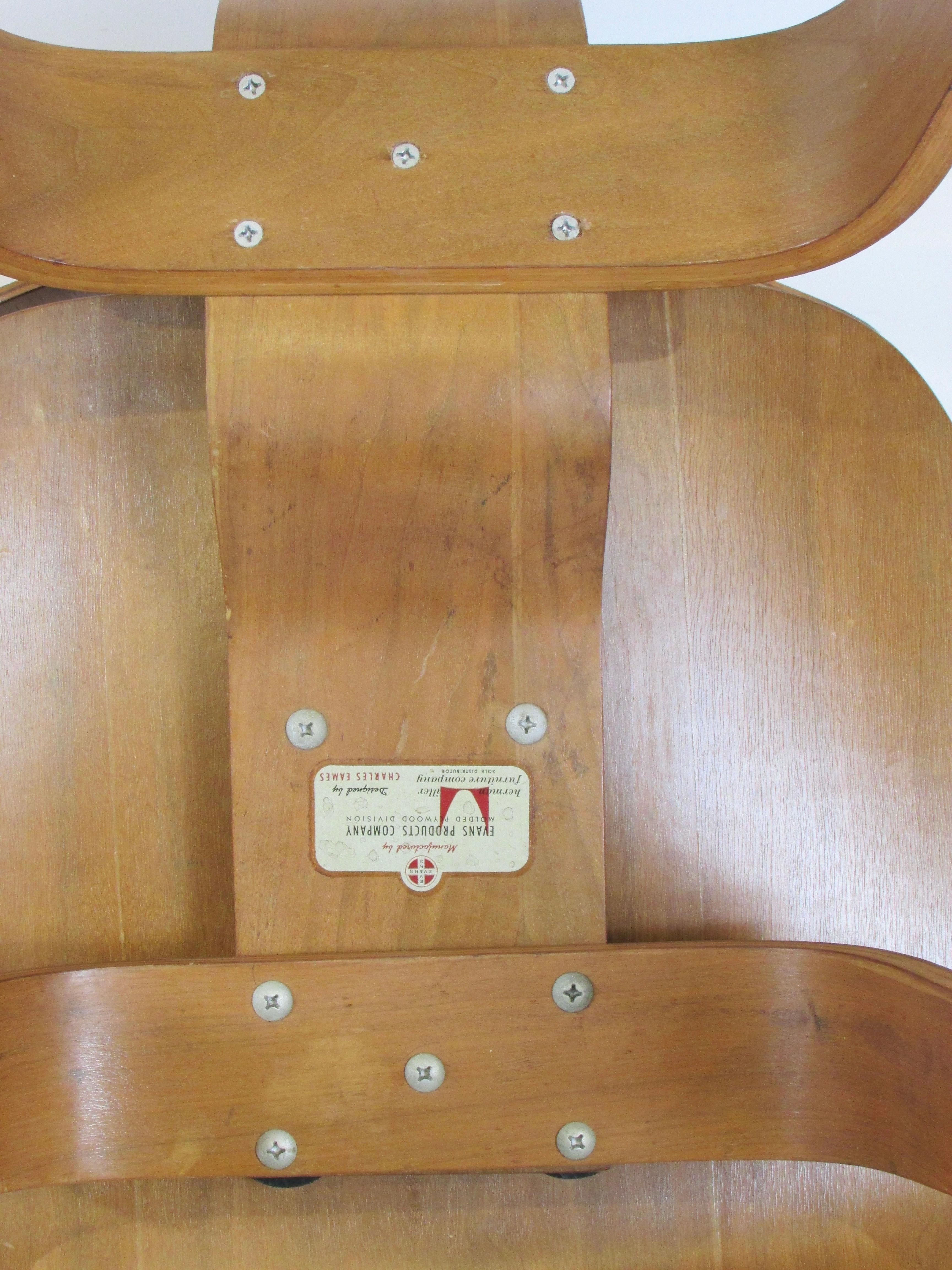 Pair of early Eames Evans Herman Miller walnut DCW chairs with labels For Sale 8