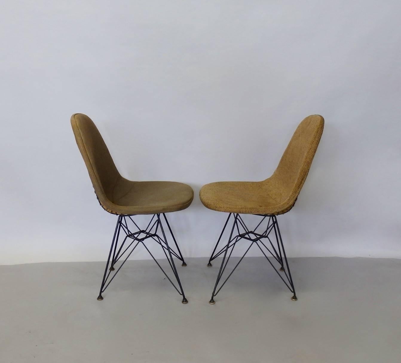 Completely original and intact Charles and Ray Eames Herman Miller DKR chairs on Eiffel tower base. Original seat covers retain labels show some minor wear. All original hardware and glides. Pair are from the same home but have different covers.