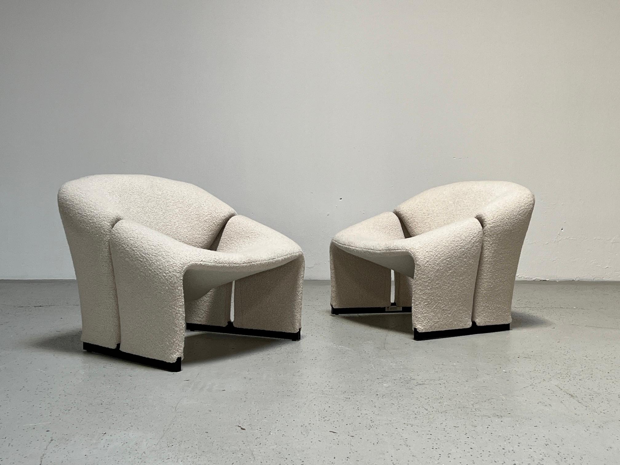 A pair of model F580 lounge chairs by Pierre Paulin for Artifort. These earlier examples are more sculptural and have a smaller footprint than the later versions. 
Fully restored and upholstered in Holly Hunt / Great Plains / Chalet / Snow.