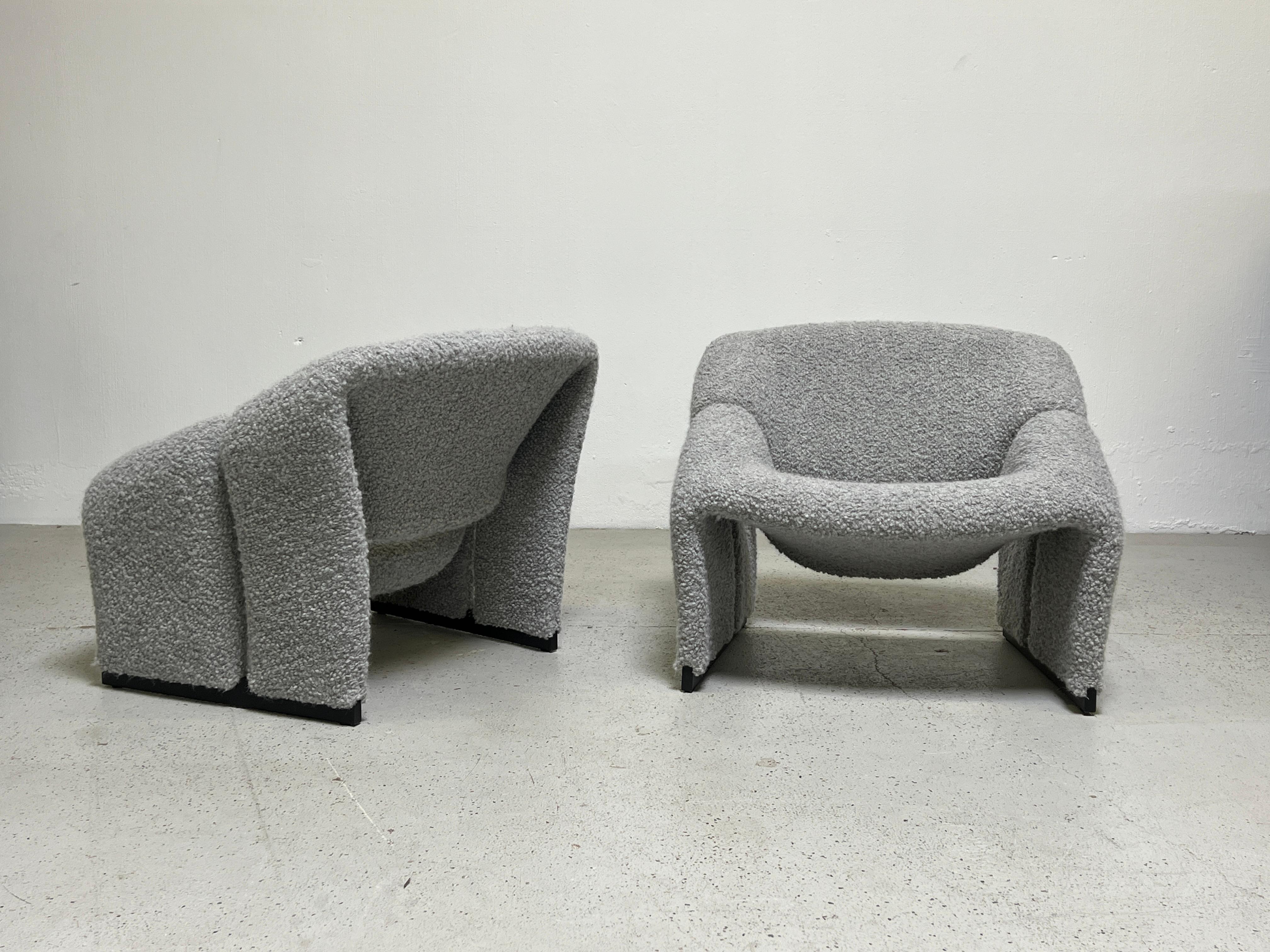 A pair of model F580 lounge chairs by Pierre Paulin for Artifort. These earlier examples are more sculptural and have a smaller footprint than the later versions. 
Fully restored and upholstered in Holly Hunt / Teddy / Warm Silver.