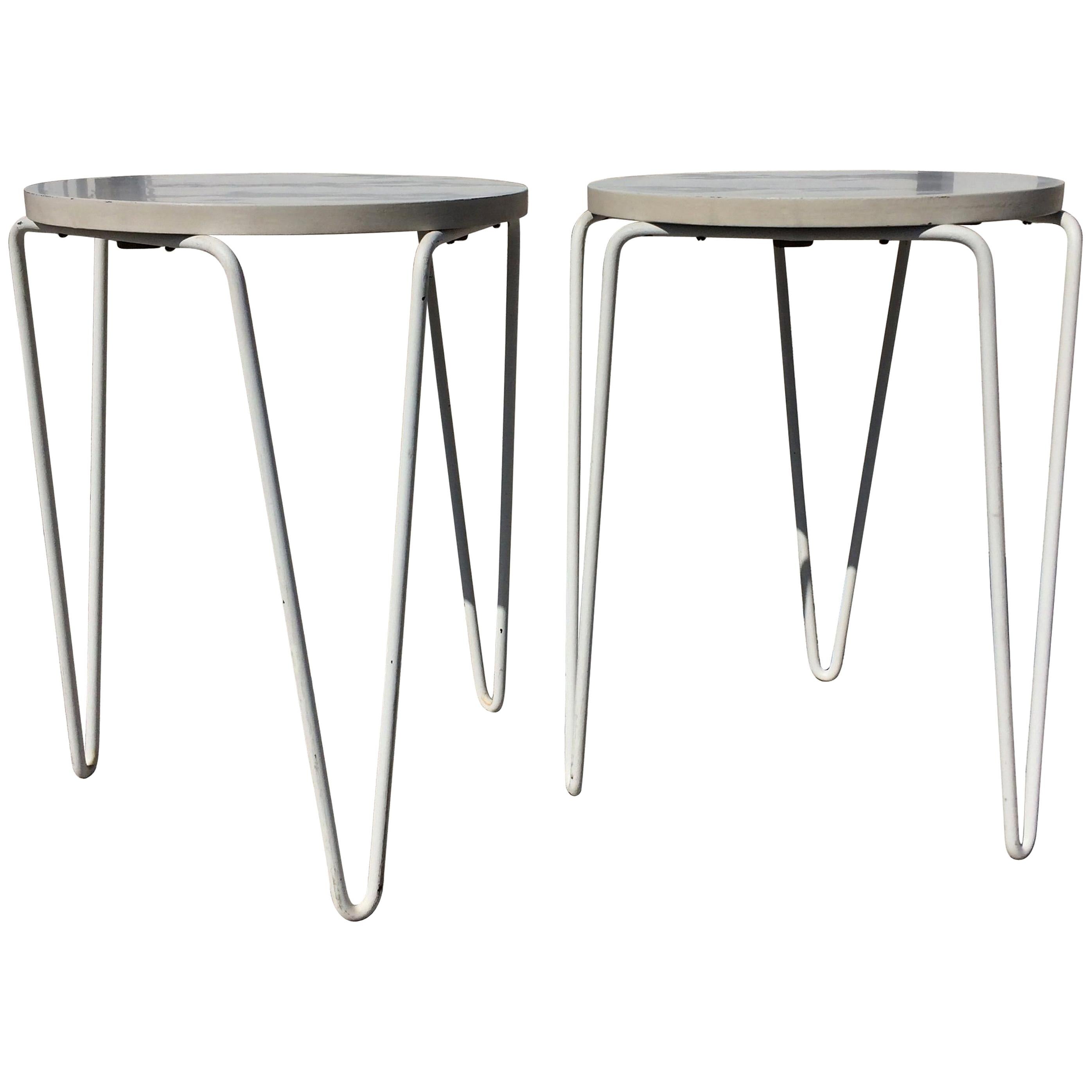 Laminate tops on white hairpin legs. Great as side tables or stools.