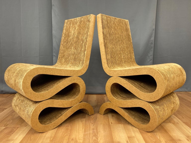 A rare pair of early 1970s Wiggle side chairs by Frank O. Gehry from his innovative and iconic Easy Edges collection of cardboard furniture.

Conceived in 1969 and launched in 1972 to critical and popular acclaim, the original production run of