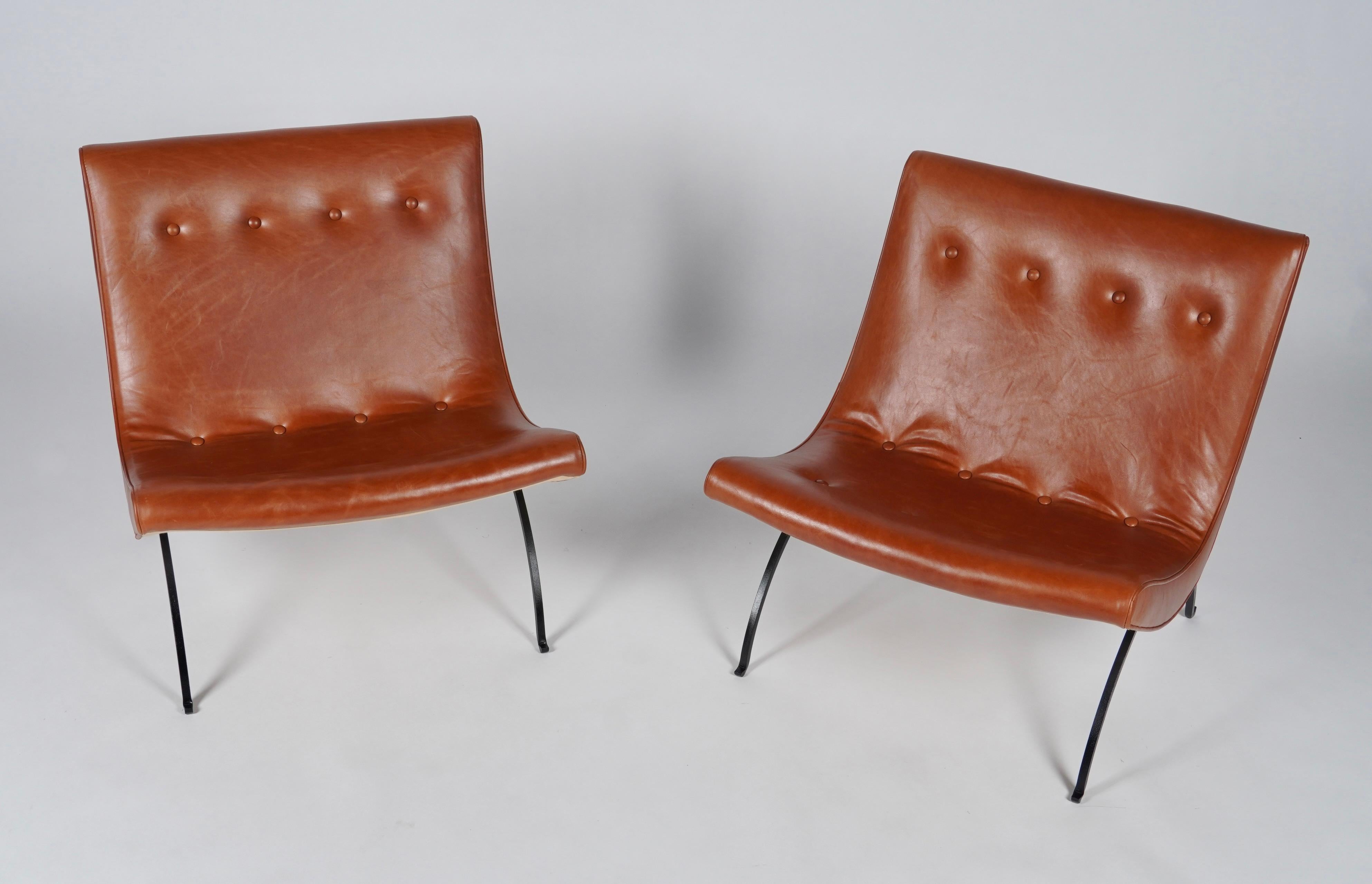 Pair of early 1950s Milo Baughman Scoop lounge chair reupholstered in a buttery soft leather. With half circle wrought iron legs with up turned ends which was the indicator of the first production lounges by Thayer Coggin.