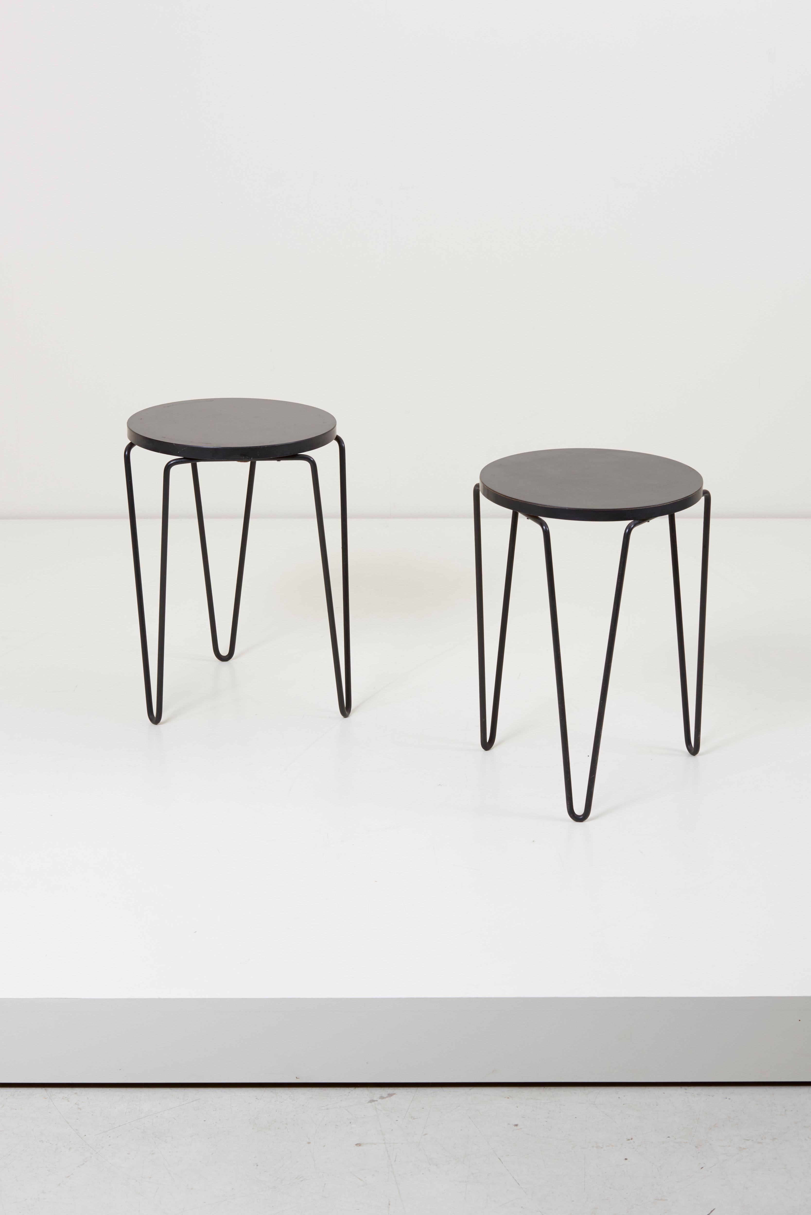 Pair of Classic three-legged stools or side tables with round top and lacquered wrought iron hairpin legs designed by Florence Knoll.