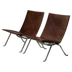 Coppia di prime sedie da salotto PK22 in pelle di Poul Kjærholm per EKC, anni '70