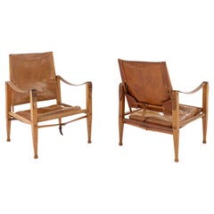 Pair of early safari chairs in ash and patinated niger leather by Kaare Klint