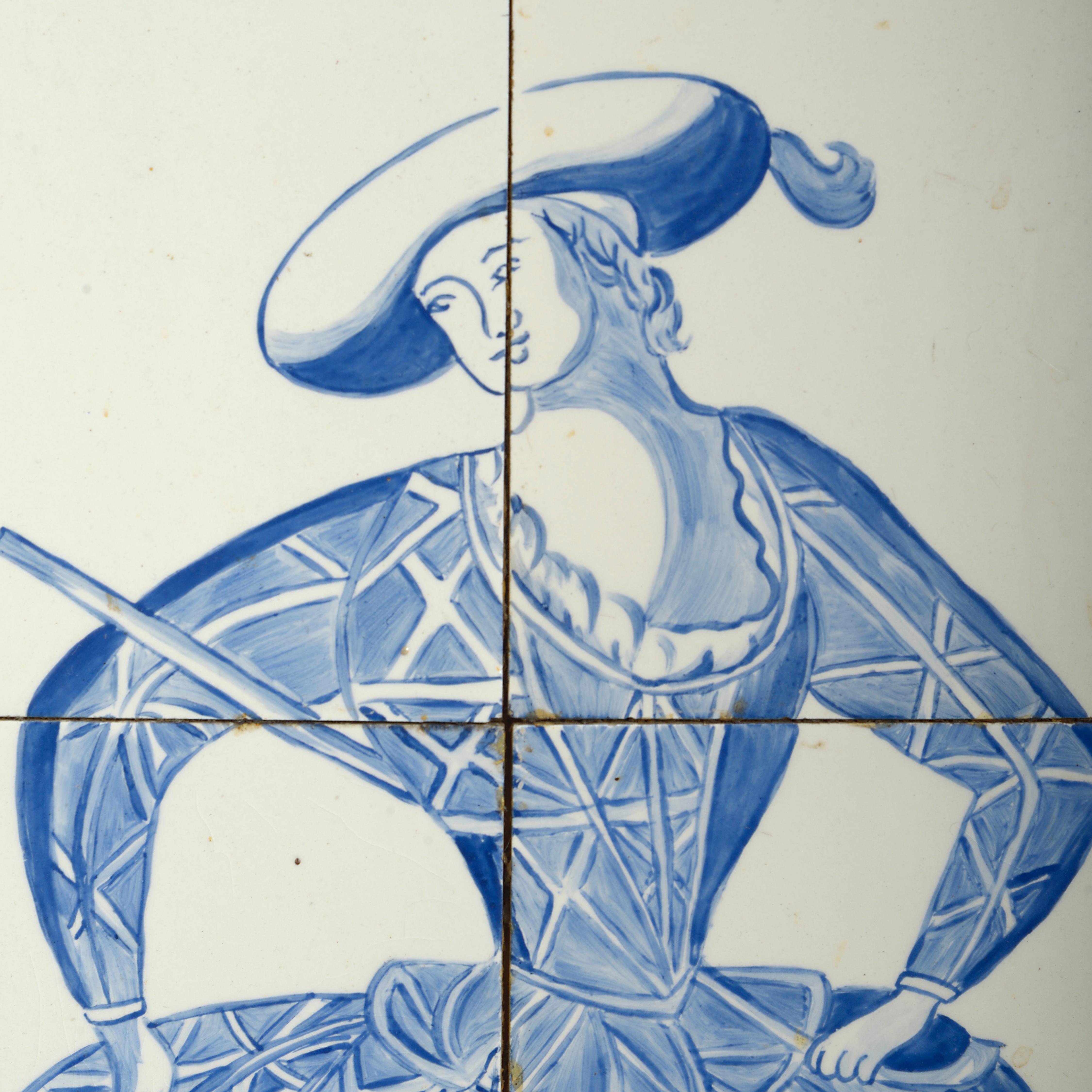 A charming pair of early 20th century blue and white glazed Delft pottery tile pictures, depicting a male harlequin figure and a fashionable female character, set within wooden frames. Each picture consisting of six tiles.